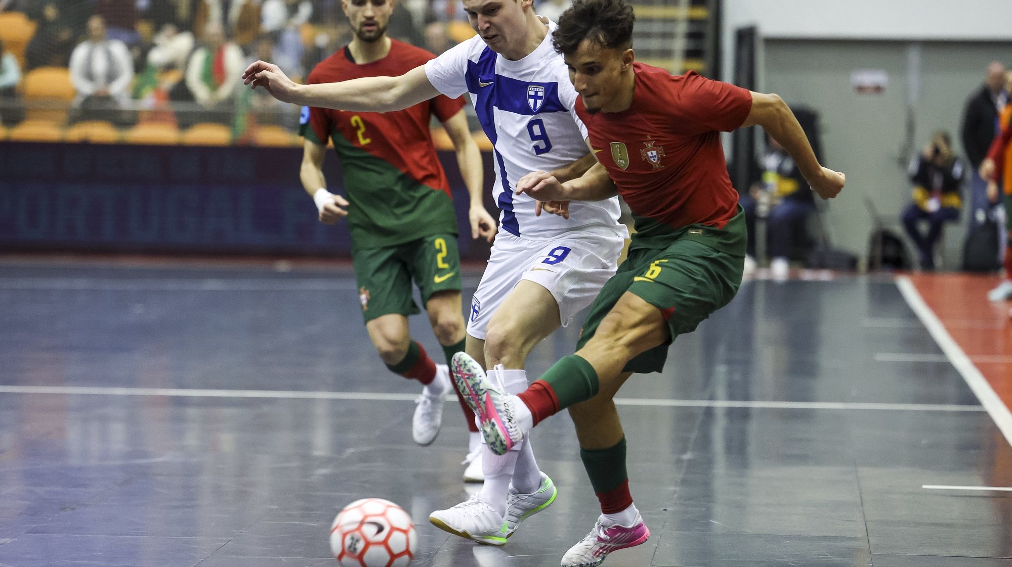 Lúcio JR (R) from Portugal and Aleksi Kylmala of Finland in action during the 5th round of Group E of the Elite Round of access to the 2024 Futsal World Cup, held at Pavilhao Mario Mexia, in Coimbra, Portugal, 15 December 2023. PAULO NOVAIS/LUSA