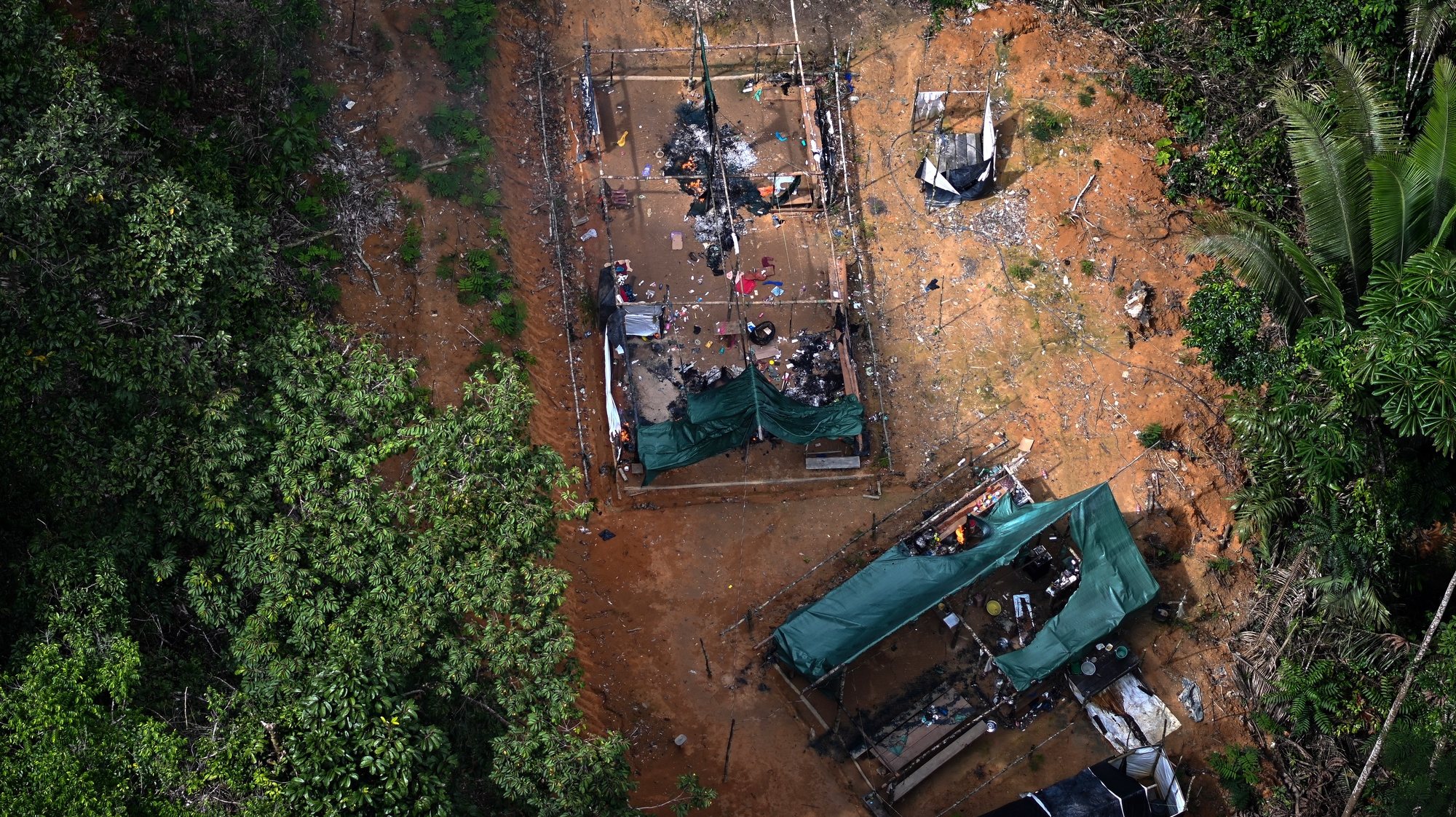 epa10469401 An illegal miners camp is seen during an operation by Brazilian authorities against the advance of deforestation and illegal mining in the Itaituba II Environmental Forest, Brazil, 15 February 2023. The surroundings of Itaituba, in the state of Para in northern Brazil, is one of the areas of the jungle most affected by deforestation.  EPA/Andre Borges
