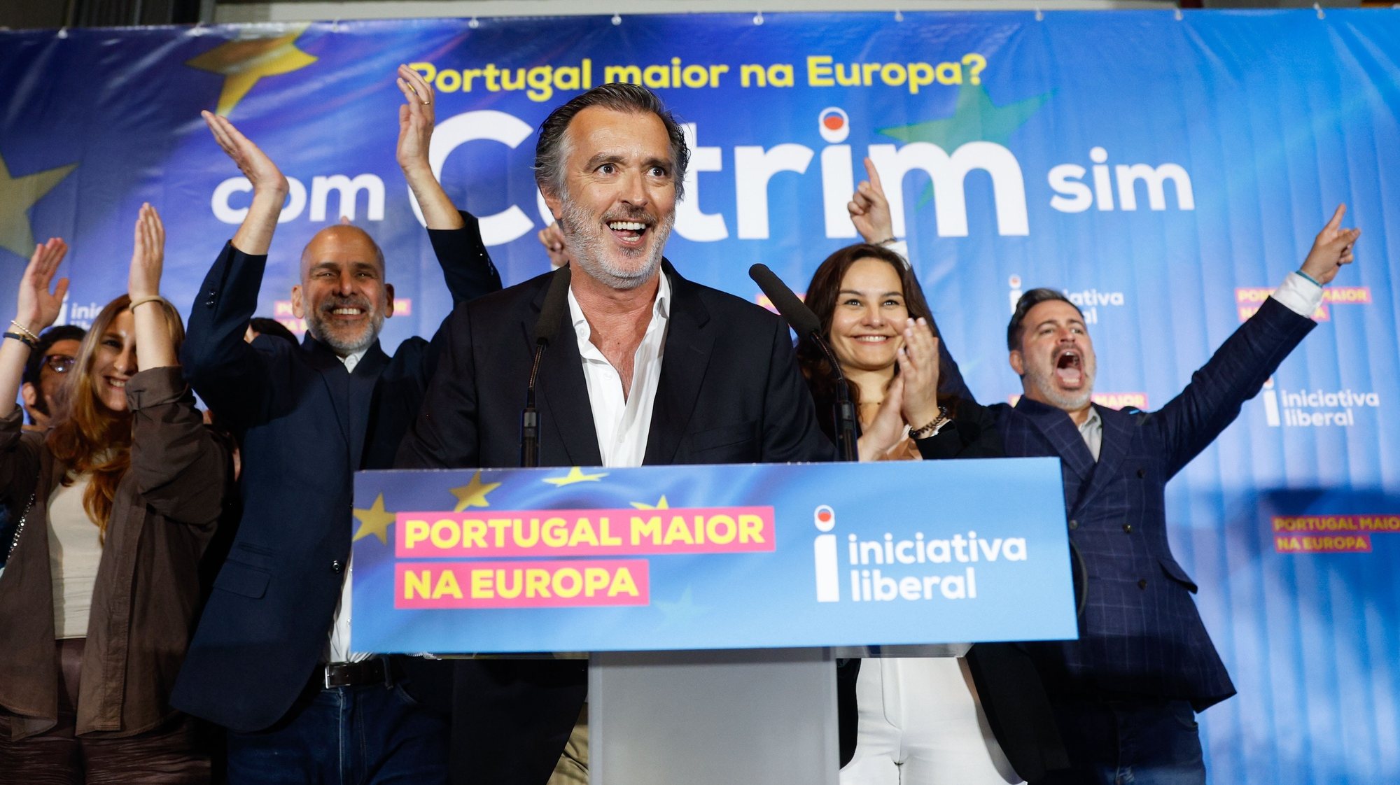 epa11401359 The candidate of the Iniciativa Liberal (IL) party Joao Cotrim de Figueiredo (C) reacts at the party electoral headquarters after knowing the results of the European elections night in Lisbon, Portugal, 09 June 2024. More than 10.8 million registered voters in Portugal and abroad went to the polls to choose 21 of the 720 members of the European Parliament.  EPA/ANTONIO PEDRO SANTOS