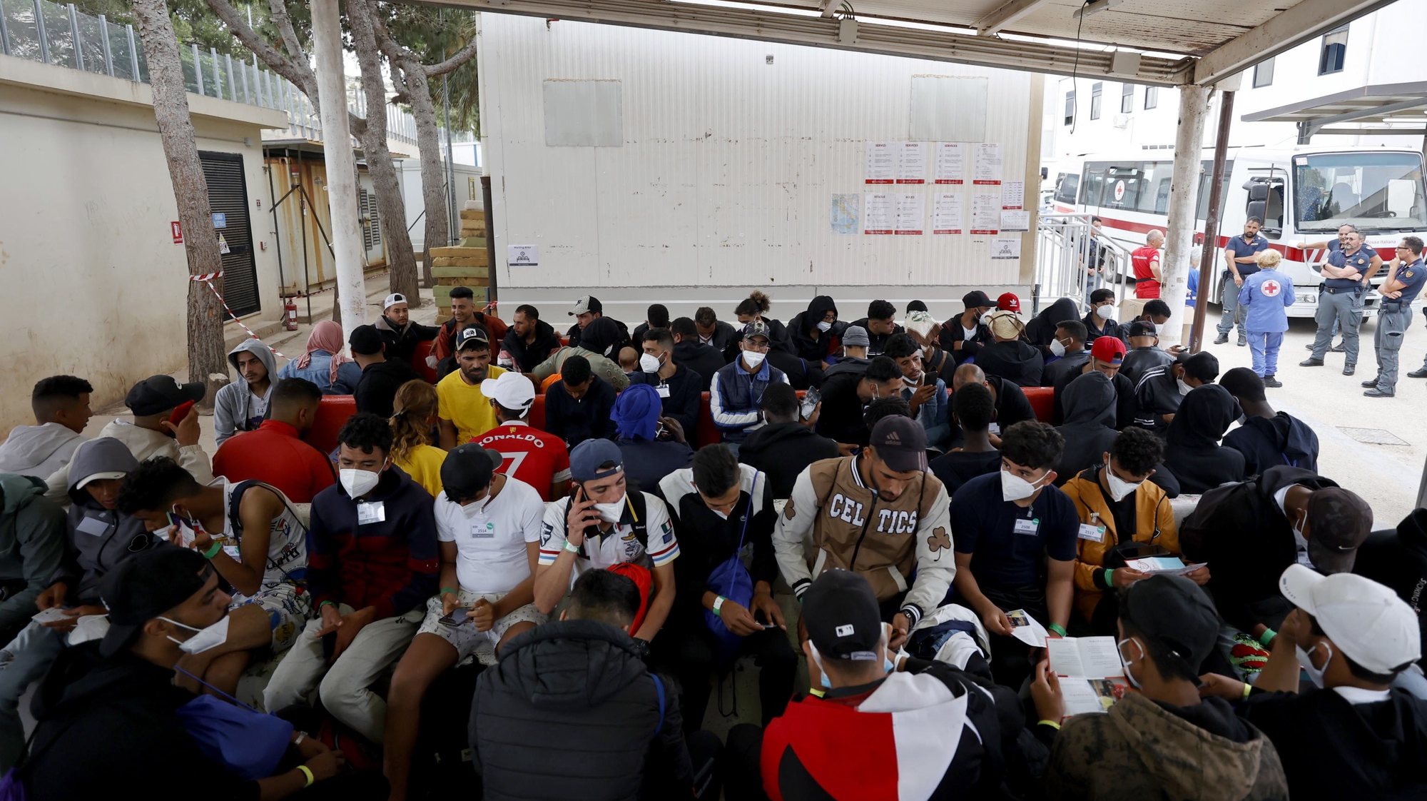 epa10692630 Migrants inside the immigrant reception facility, or &#039;hotspot&#039; on the Sicilian island of Lampedusa (Agrigento), southern Italy, 14 June 2023 (issued 15 June 2023). The Lampedusa hotspot, with a capacity to host about 650 people, is managed by the Italian Red Cross (CRI). The center is intended to provide preliminary reception, identification and triage for migrants and refugees arriving on the tiny southern Italian island. Located in the Mediterranean between Malta and Tunisia, Lampedusa is a transit point for migrants from Africa, the Middle East and Asia seeking a better life in Europe. Upcoming 20 June 2023 marks World Refugee Day under the theme &#039;hope away from home&#039;. The annual international day celebrates the people around the glove who have been forced to flee their home country to escape conflict or persecution.  EPA/VINCENZO LIVIERI  ATTENTION: This Image is part of a PHOTO SET