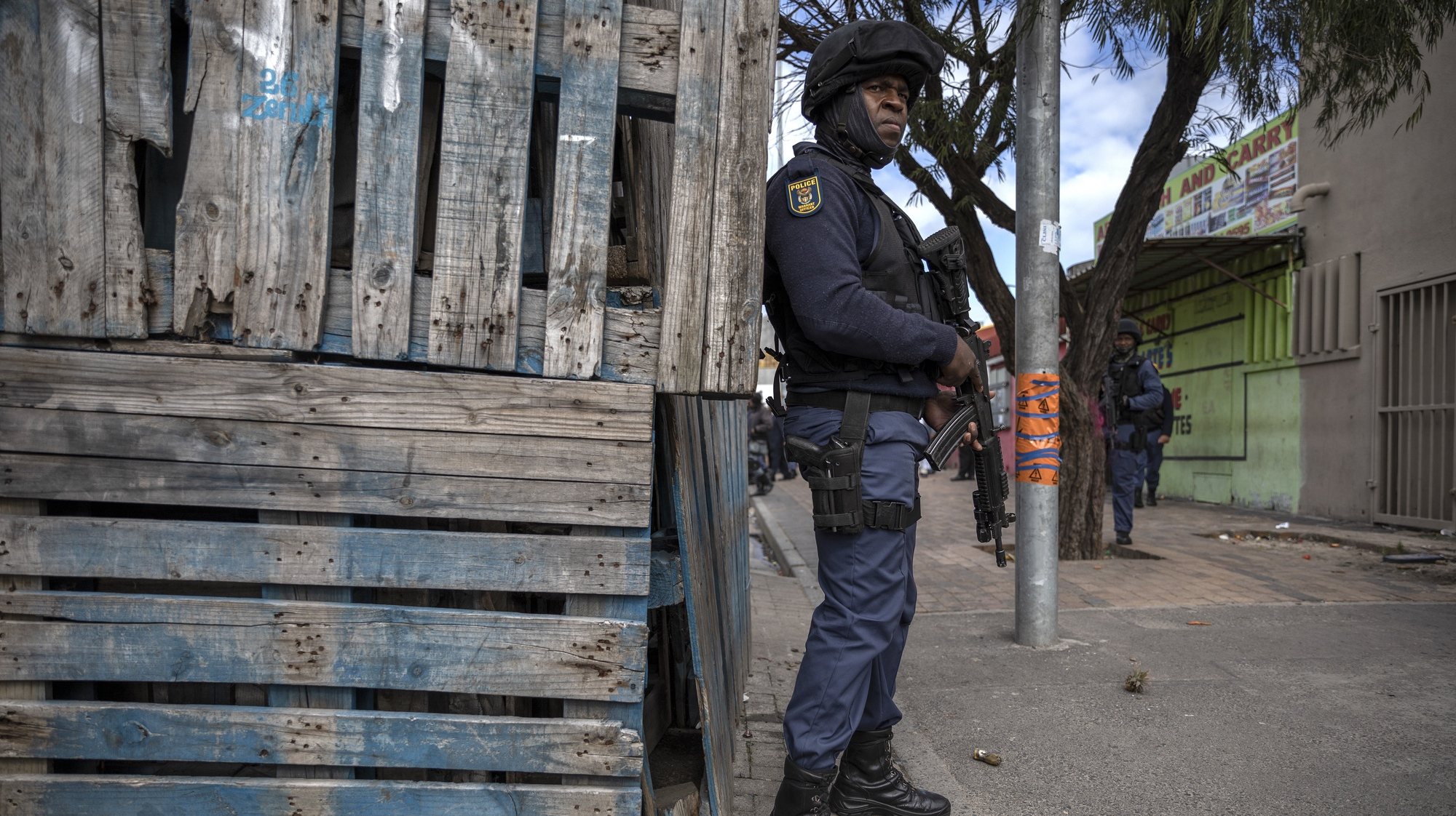 epa07770139 South African Policemen on the Cape Flats in Mitchells Plain, Cape Town, South Africa, 12 August 2019. According to South African Minister of police General Bheki Cele there have been 1004 arrests during Operation Lockdown over the past month. Operation Lockdown is a joint operation between the South African Police Services (SAPS) and the South African National Defence Force (SANDF) aimed at tackling the alarming and rising number of gang related crimes on the Cape Flats. The Cape Flats is an area where non-white South Africans from Cape Town were sent by forced removal as part of the group areas act during the apartheid era. 50 years on from this the area has become a crime hotspot in the country with rampant gang activity and high numbers of murders and killings of innocent members of the community. Over 1300 SANDF soldiers have been deployed to assist the police with this operation.  EPA/NIC BOTHMA