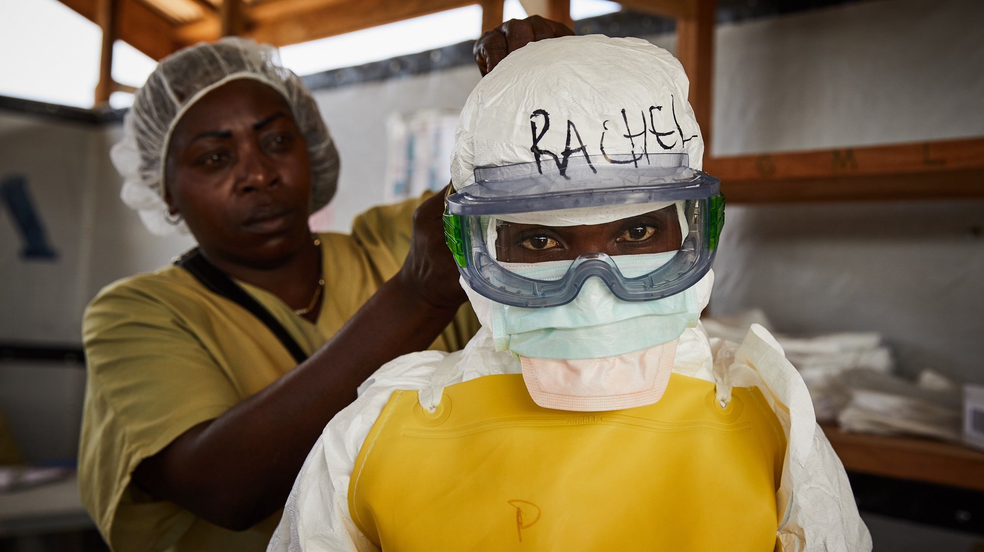 epa08891329 (20/39) Rachel Rukwati suits up in PPE to enter a high-risk treatment zone, at the peak of the Ebola crisis, at a health centre in Beni, North Kivu, Democratic Republic of Congo, 04 May 2019. Rachel was a health worker attached to the Ebola response and has first-hand experience of combating an unfamiliar virus. &#039;In the Ebola response I was a nurse, I took care of ill people, confirmed, and unconfirmed cases when they were at the CTE.In fact, the time we were entering the high-risk zone, we used to get fear, that fear was pushing us to leave the high-risk zone quickly. And when we wore the PPE costume or the protected material we were feeling muffled, then when you leave, you felt at ease because you return to your familiar feeling, compared to how you just felt breathing. The fear I had, was that I could get contaminated as a nurse. When I went to treatment zones I had fear.Since I left the response, I feel that I haven’t recovered my health as it was before… the feeling we used to get in the treatment centers, we sense there are some things we lost.As coronavirus spreads, to the world, from myself as a health worker from Beni, and the Ebola response; I would tell them that when they notice the virus in their town, they should first accept it like a disease, not like politics, they will not be able to fight it like that. When you react to a disease, you will overcome it, using measures and precautions.&#039; EPA/Hugh Kinsella Cunningham ATTENTION EDITORS / MANDATORY CREDIT : This story was produced in partnership with the Pulitzer Center -- For the full PHOTO ESSAY text please see Advisory Notice epa...