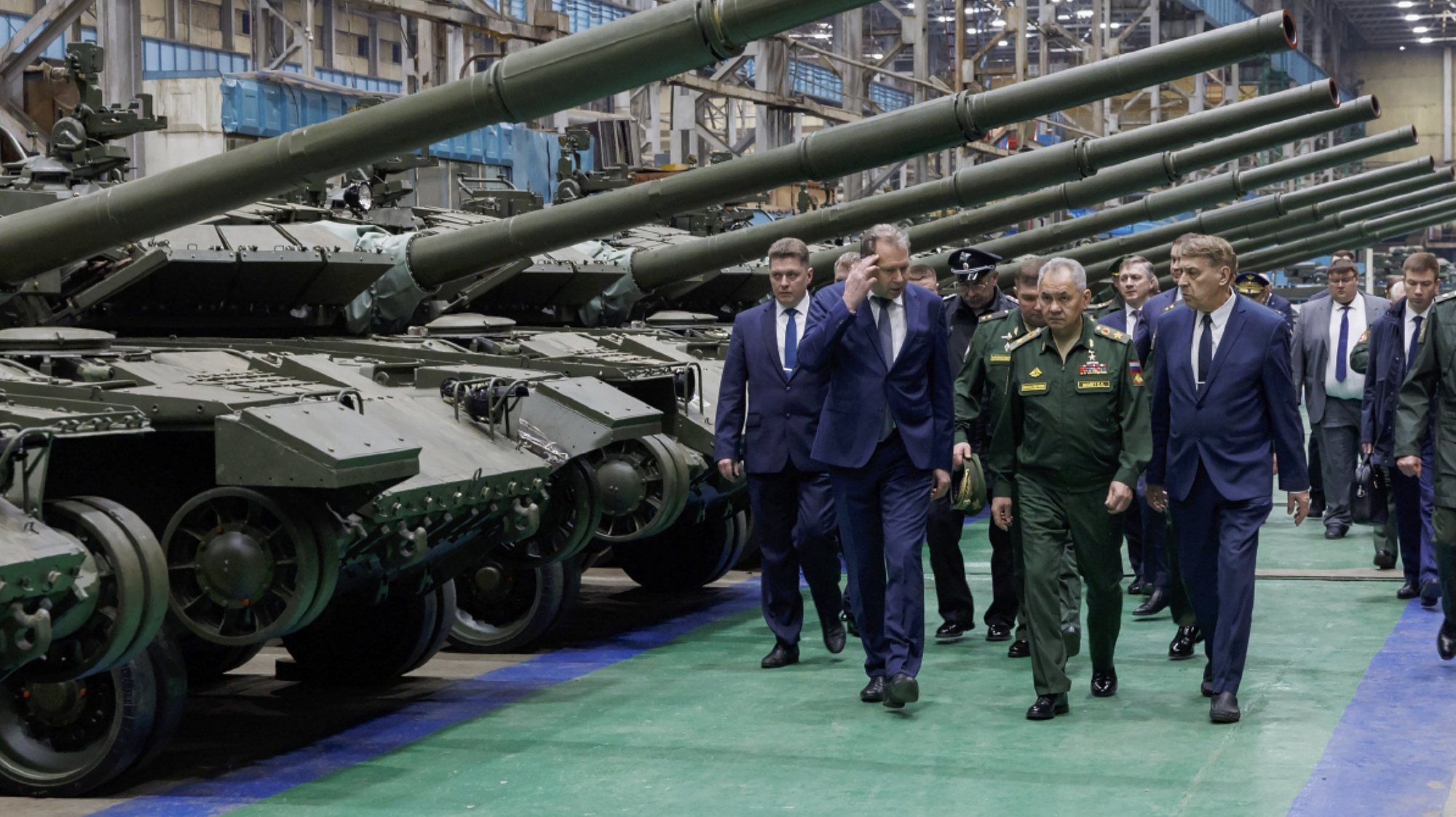epa11288320 A handout photo made available by the Russian Defence Ministry Press Service shows Russian Defense Minister Sergei Shoigu (C) inspecting the implementation of the state defense order at the enterprises of the military-industrial complex in the Omsk region, Russia, 19 April 2024. Acording to the Russian Defense Ministry press service, over the past year the company increased the production of TOS-1A Solntsepek heavy flamethrower systems by 2.5 times. The number of production of heavy flamethrower systems increased due to the expansion of production capacity, the transition to round-the-clock work on a two-shift schedule and an increase in the number of personnel. Currently, at the plant, during the production of new T-80BVM tanks, the armored vehicles are already equipped on the assembly line with the &#039;Cape&#039; camouflage system and a protective visor. All armored vehicles are shipped by the company immediately with an additional turret protection module.  EPA/RUSSIAN DEFENCE MINISTRY PRESS SERVICE HANDOUT   HANDOUT EDITORIAL USE ONLY/NO SALES HANDOUT EDITORIAL USE ONLY/NO SALES