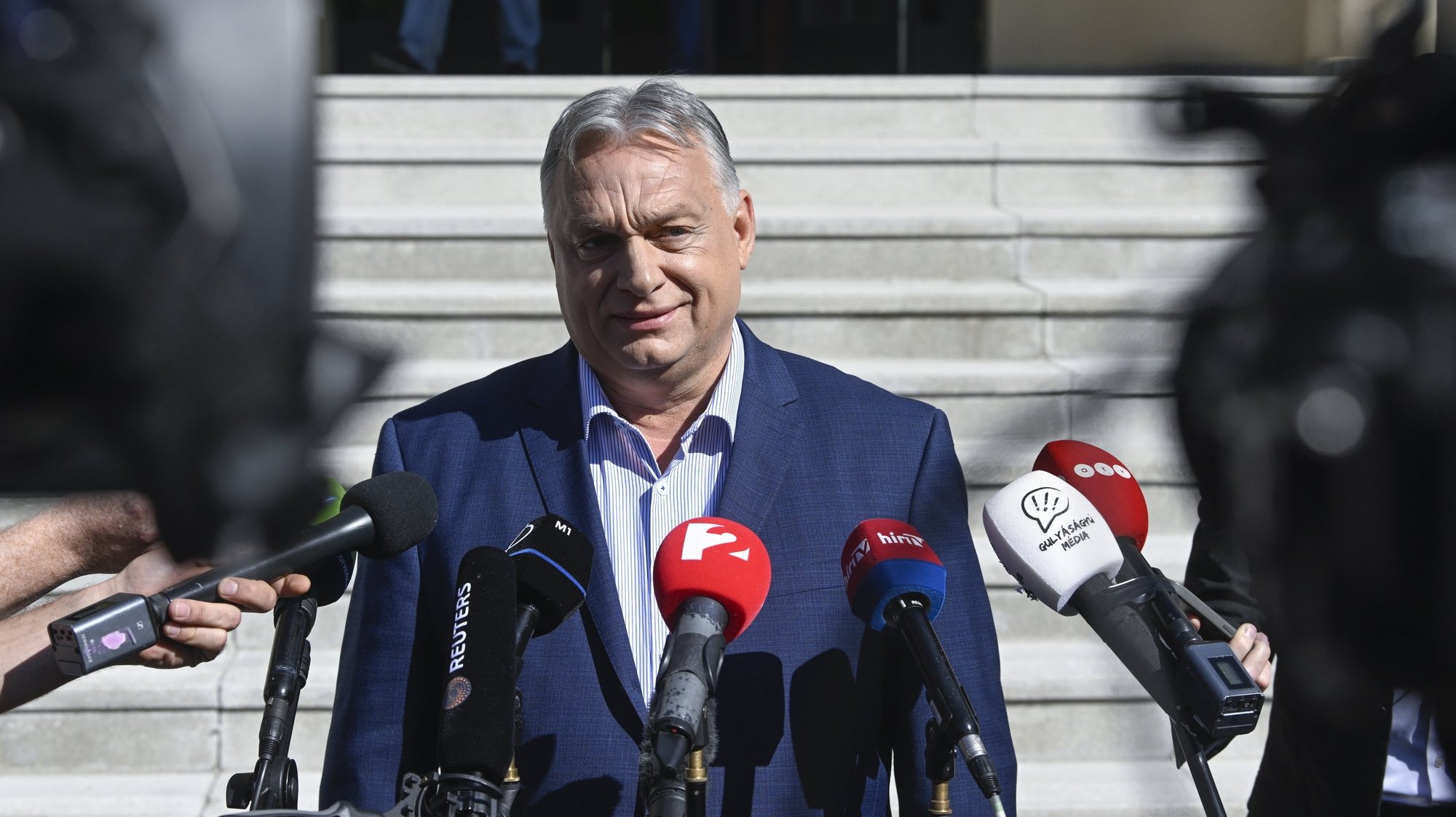 epa11398961 Hungarian Prime Minister Viktor Orban, leader of the ruling Fidesz party, speaks to the media after casting his vote at a polling station during the European Parliament and the local elections in Budapest, Hungary, 09 June 2024. The European Parliament elections take place across EU member states from 06 to 09 June 2024.  EPA/Szilard Koszticsak HUNGARY OUT