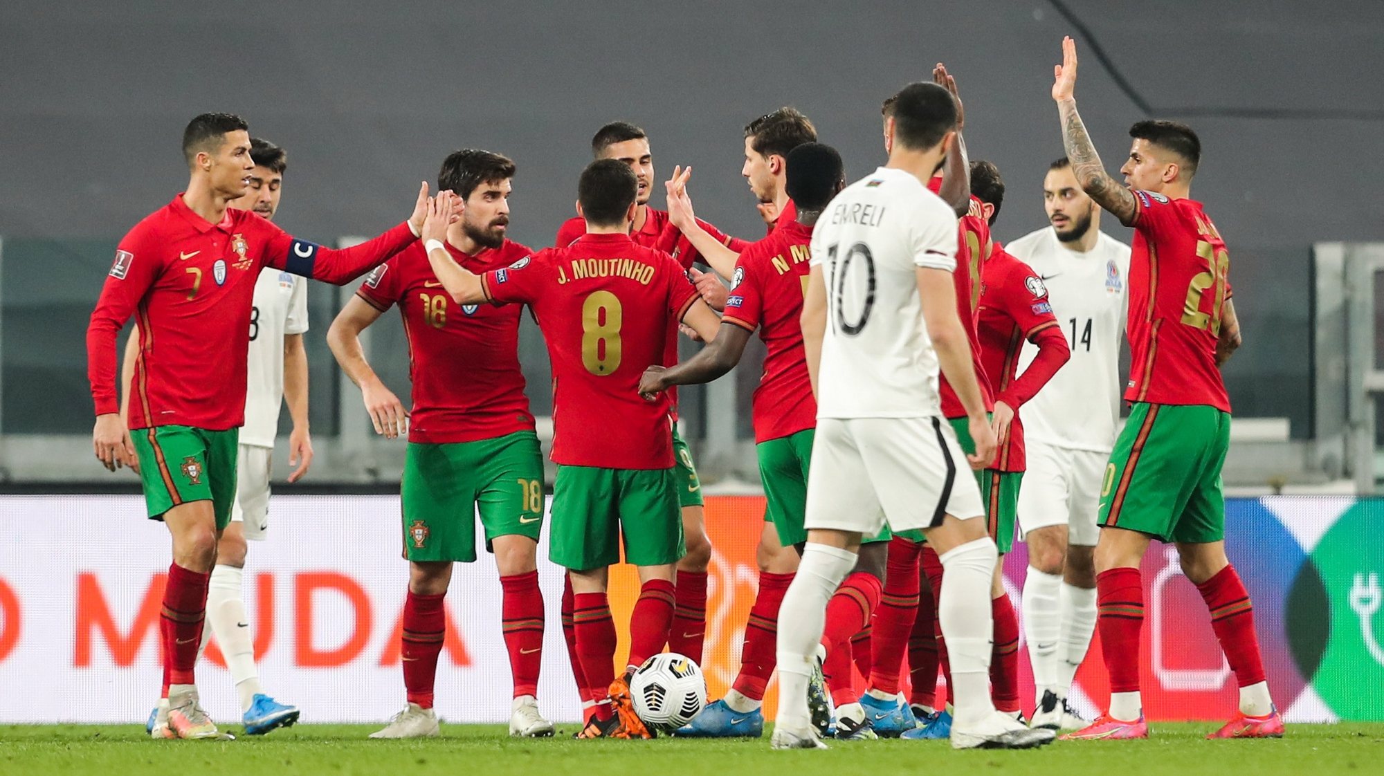 epa09094785 Portugal soccer players celebrate after Maskim Medvedev of Azerbaijan scored an own-goal during the FIFA World Cup Qatar 2022 Group A qualifier match Portugal against Azerbaijan in Turin, Italy, 24 March 2021.  EPA/MIGUEL A. LOPES