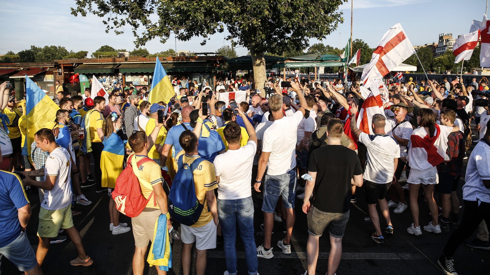 epa09320890 Supporters on their way to Olimpic Stadium prior to the UEFA EURO 2020 quarter final match between Ukraine and England in Rome, Italy, 03 July 2021.  EPA/FABIO FRUSTACI