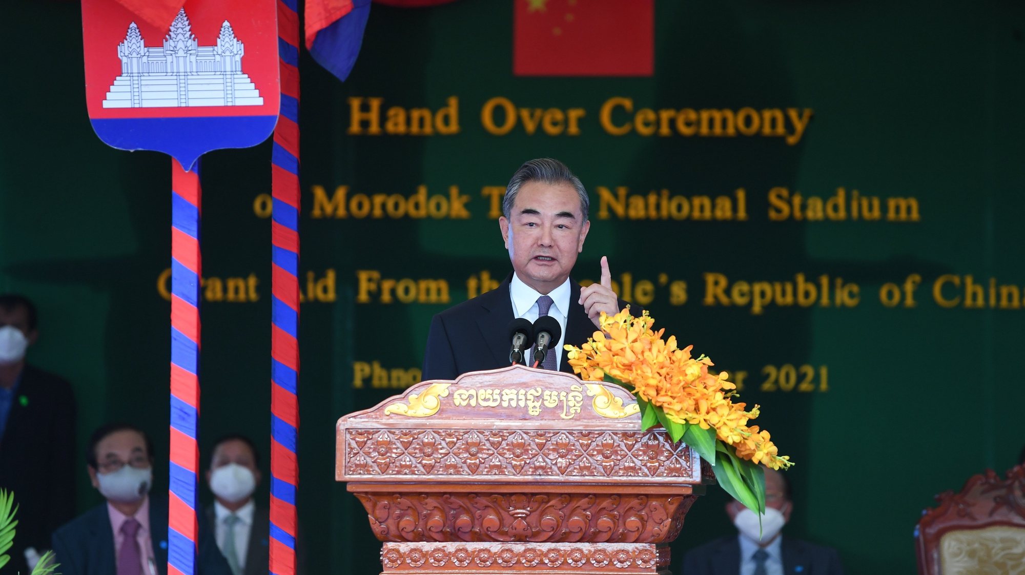 epa09463447 Chinese Foreign Minister Wang Yi speaks during a handover ceremony of the Morodok Techo National Stadium in Phnom P?enh, Cambodia, 12 September 2021. Wang Yi is on an official visit to Cambodia, during which he met with Cambodian Prime Minister Hun Sen and attended a handover ceremony of the Morodok Techo National Stadium funded by the Chinese government.  EPA/TANG CHHIN SOTHY / POOL