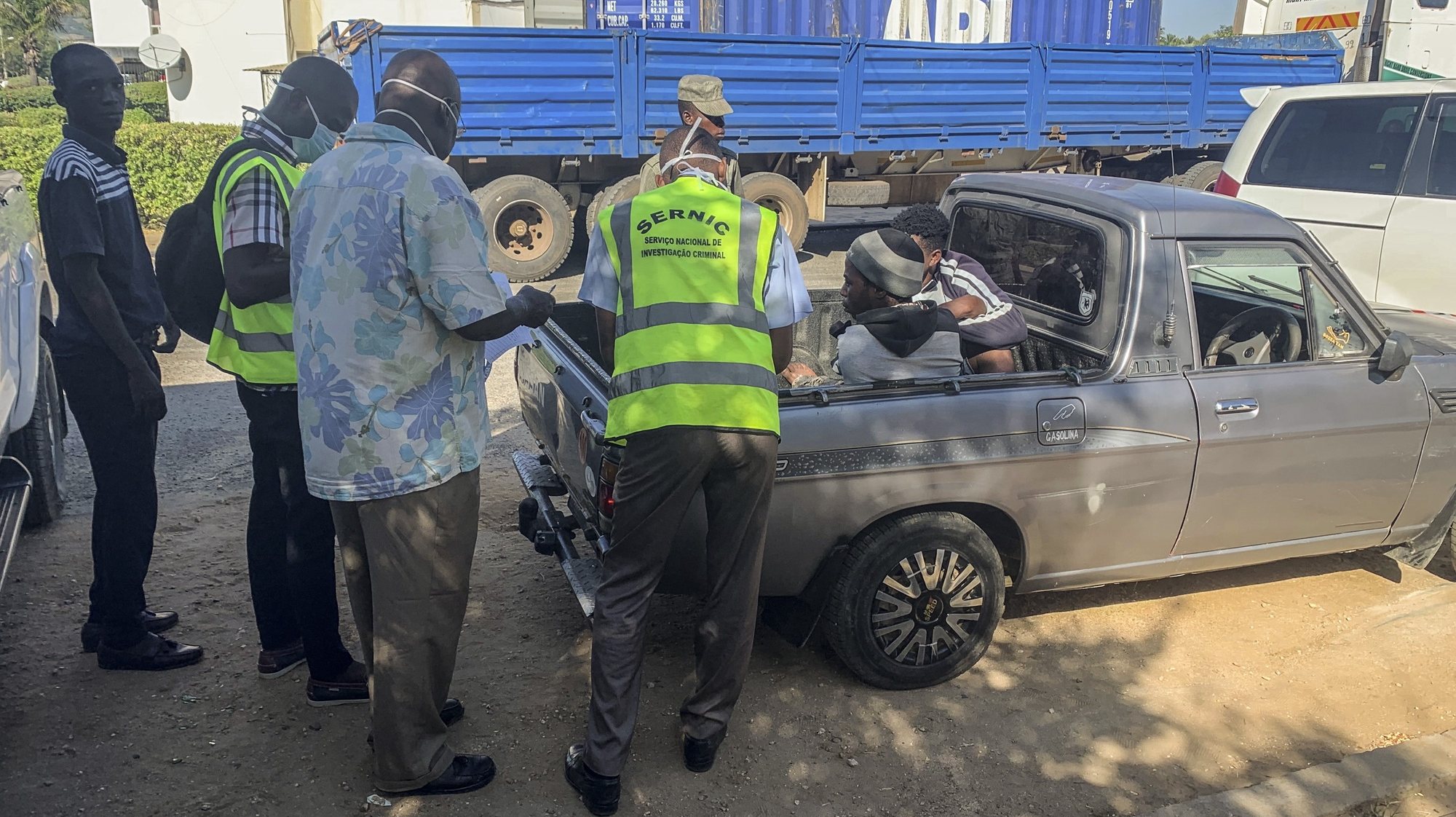 Police inspect some of the 14 illegal immigrants survivors (R) found in a container transported on a truck in Tete province, in the western part of Mozambique, Mussacama, 24th March 2020.  According to the same sources, were found 64 people dead and 14 survivors and the deaths are said to have been due to asphyxiation and the victims are said to be illegal immigrants from different countries who crossed the border from Malawi to Mozambique.  LUSA