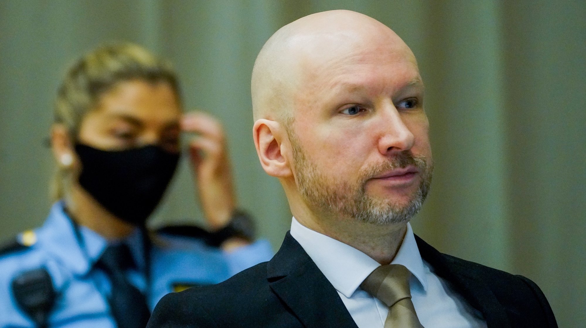epa09692606 Anders Behring Breivik, convicted of terrorism, attends the first day of his parole hearing, in Skien, Norway, 18 January 2022. Breivik, who changed his name to Fjotolf Hansen in 2017, is to appear before court for his three-days parole hearing in Oslo on 18 January 2022. Mass murderer Anders Behring Breivik was sentenced to a maximum term of 21 years for killing 77 people in bomb and shooting attacks on 22 July 2011, and is entitled under Norwegian law to have his sentenced reviewed after ten years served. The case is being processed by Telemark District Court, but is physically taking place in a makeshift courtroom in Skien prison.  EPA/Ole Berg-Rusten / POOL NORWAY OUT