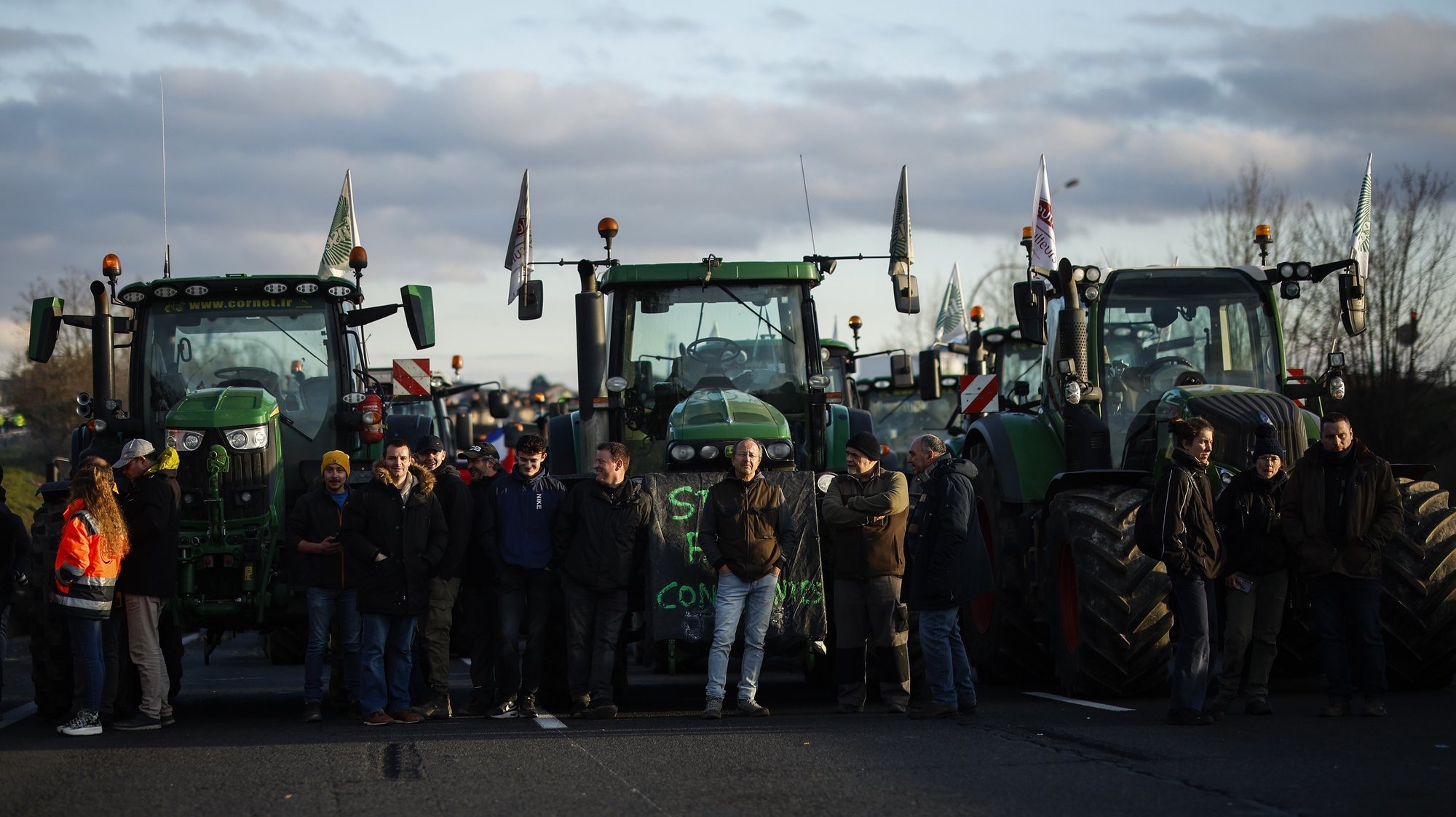 epa11116425 Dozens of tractors block part of the A6 motorway in Chilly-Mazarin, south of Paris, France, 31 January 2024. French farmers continue their protests with road blockades and demonstrations in front of state buildings awaiting a response from the government to their request for &#039;immediate&#039; aid of several hundred million euros. On 23 January, the EU Agriculture and Fisheries Council highlighted the importance of providing the conditions necessary to enable EU farmers to ensure food security sustainably and profitably, as well as ensuring a fair income for farmers.  EPA/YOAN VALAT