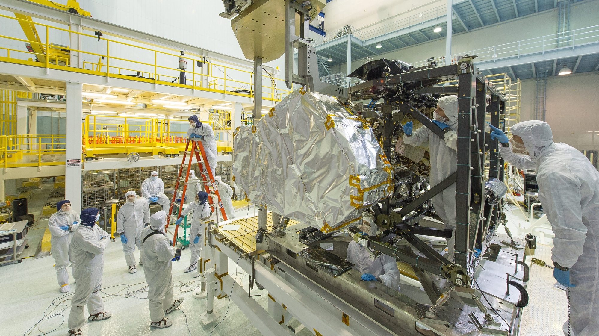 epa04151211 A handout image dated 25 March 2014 and provided by NASA 02 April 2014 showing the James Webb Space Telescope&#039;s Near Infrared Spectrograph (NIRSpec) being installed into the instrument module. The James Webb Space Telescope is a large space telescope, optimized for infrared wavelengths. It is scheduled for launch later in this decade. Webb will find the first galaxies that formed in the early universe, connecting the Big Bang to our own Milky Way galaxy. Webb will peer through dusty clouds to see stars forming planetary systems, connecting the Milky Way to our own solar system. Webb&#039;s instruments will be designed to work primarily in the infrared range of the electromagnetic spectrum, with some capability in the visible range.  EPA/NASA / CHRIS GUNN / HANDOUT  HANDOUT EDITORIAL USE ONLY