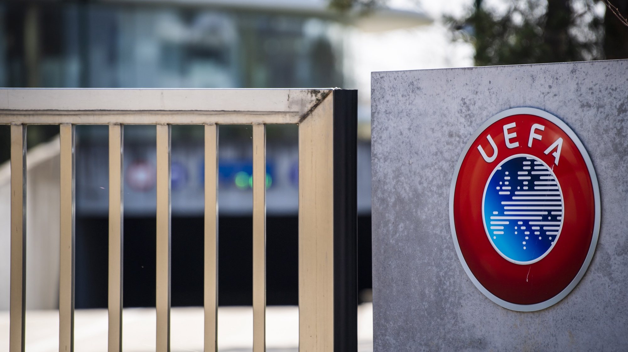 epa08337221 (FILE) - The UEFA logo is pictured at the entrance of the UEFA headquarters in Nyon, Switzerland, 17 March 2020 (re-issued on 01 April 2020). The UEFA has postponed on 01 April all planned matches of the national team&#039;s in June until further notice. The same applies to Champions and Europa League matches of this season.  EPA/JEAN-CHRISTOPHE BOTT