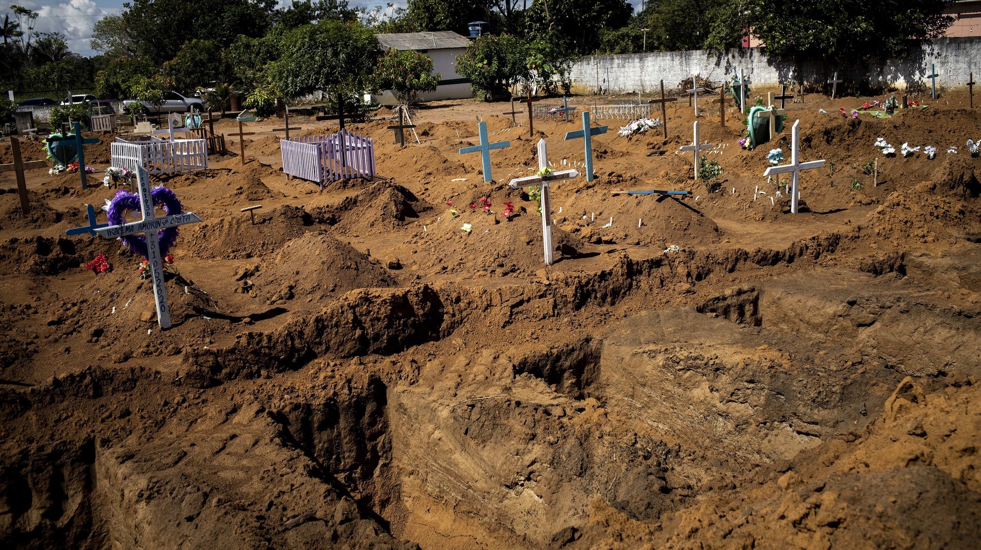epa08477101 View of open graves in Campo da Saudade cemetery, in Manacapuru, Amazonas, Brazil, 08 June 2020 (Issued 10 June 2020). The residents of Manacapuru still mourn the death of one of the few doctors who worked in this city in the Brazilian Amazon. He died of coronavirus. The last blow to this remote town that has one of the highest death rates from COVID-19 in all of Brazil. Manacapuru, in the interior of the state of Amazonas (north), has lived through hell in the heart of the jungle. The pandemic has entered with unusual virulence in this territory bathed by the waters of the largest river on the planet.  EPA/RAPHAEL ALVES  ATTENTION: This Image is part of a PHOTO SET