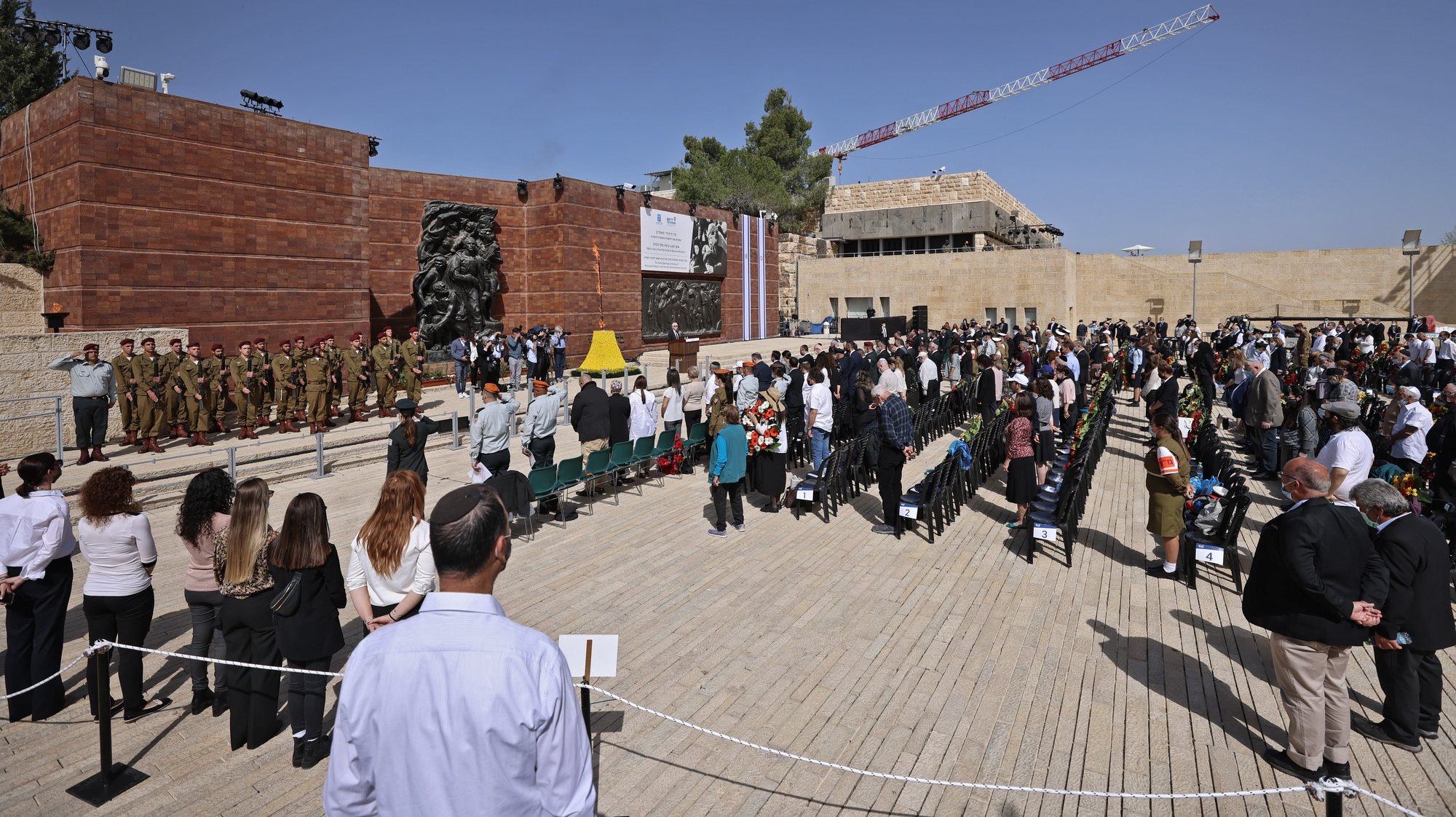 epa09121793 A general view shows a wreath-laying ceremony marking the Holocaust Remembrance Day at Warsaw Ghetto Square in Jerusalem&#039;s Yad Vashem memorial on 08 April 2021.  EPA/EMMANUEL DUNAND / POOL