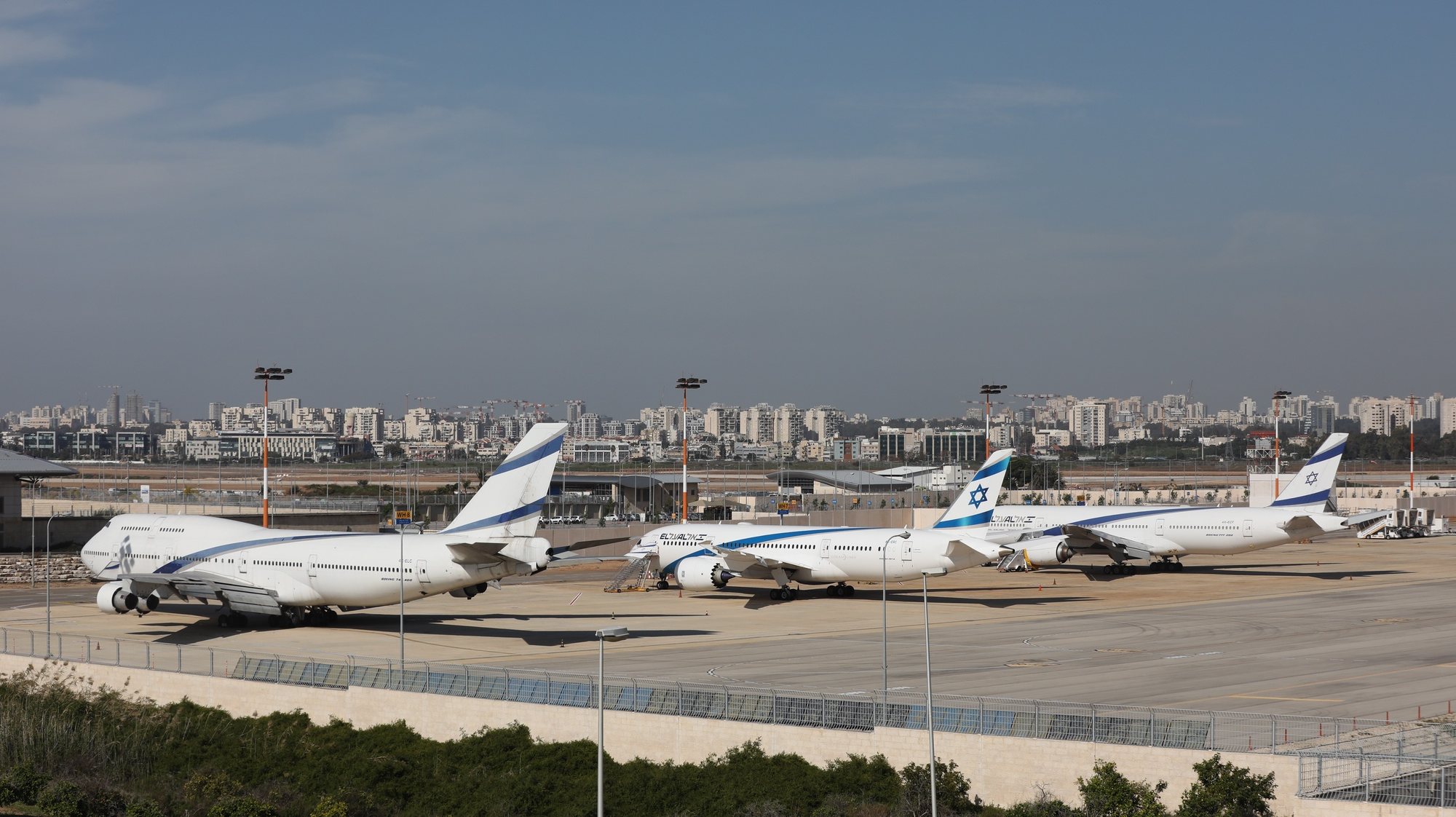 epa08963936 ELAL airplanes stand still at the Ben Gurion International Airport near Tel Aviv, Israel, 25 January 2021. Media report that government approved a total close down of the Ben gurion airport as part of the efforts to prevent the entry of a mutation of the pandemic COVID-19 virus. Although Israel is one of the first countries to have received vaccines and has so far vaccinated more than two million of its around nine million citizens, the rate of infection with the Sars-CoV-2 coronavirus, that causes the coronavirus disease (COVID-19), is rising drastically as Israel entered a full closure of two weeks.  EPA/ABIR SULTAN