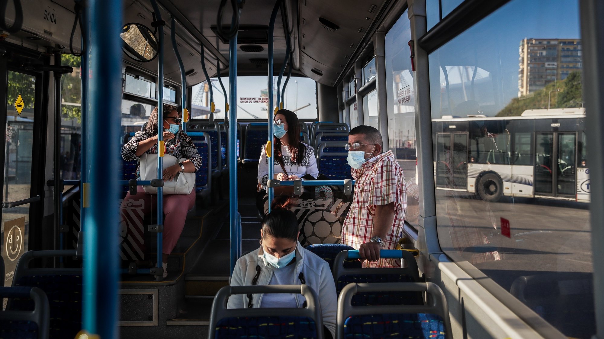 People inside a bus at Cacilhas Bus station, Almada, Portugal, 20 May 2020. Public transportation has been strengthened with the entry of the second phase of deconfinement due to the covid-19 pandemic, despite this, careers are still short, which contrasts with the large use of river transport by Transtejo/Soflusa. MARIO CRUZ/LUSA