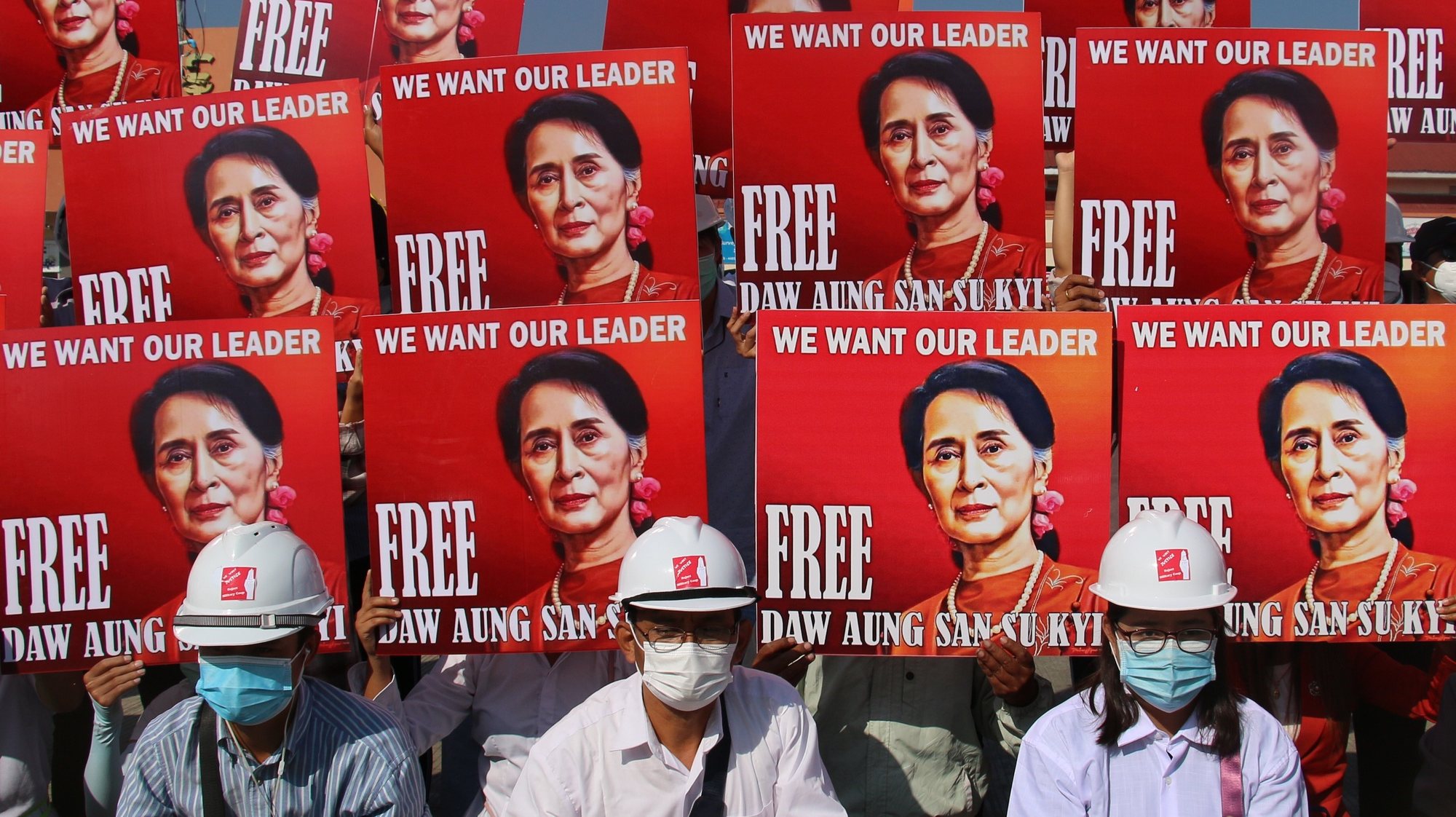 epa09269323 (FILE) - Demonstrators hold up placards calling for the release of detained Myanmar State Counselor Aung San Suu Kyi during a protest against the military coup in Naypyitaw, Myanmar, 15 February 2021(reissued 14 June 2021). The trial of deposed leader Aung San Suu Kyi will hear its first testimony in court on 14 June 2021. Aung San Suu Kyi was detained in February 2021 after her government was overthrown by the military in a coup.  EPA/STRINGER
