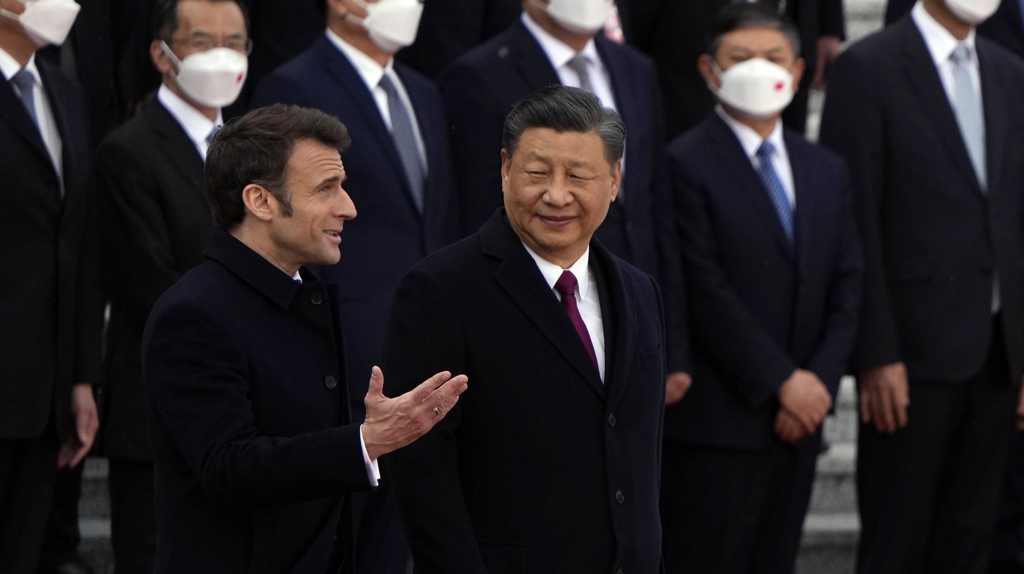 epa10561181 French President Emmanuel Macron (L) chats with Chinese President Xi Jinping (R) during a welcome ceremony held outside the Great Hall of the People in Beijing, China, 06 April 2023.  EPA/Ng Han Guan / POOL
