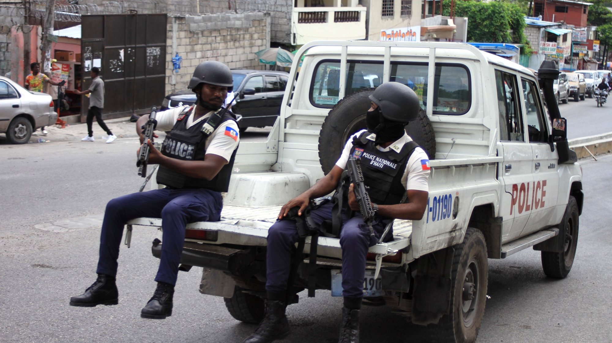 epa10593566 Police officers patrol a street amid widespread insecurity, in Port-au-Prince, Haiti, 26 April 2023. Insecurity in Haiti, which has intensified in recent weeks as armed gangs fight for control, was the subject of a UN Security Council briefing on 26 April.  EPA/Dorcin Lesly