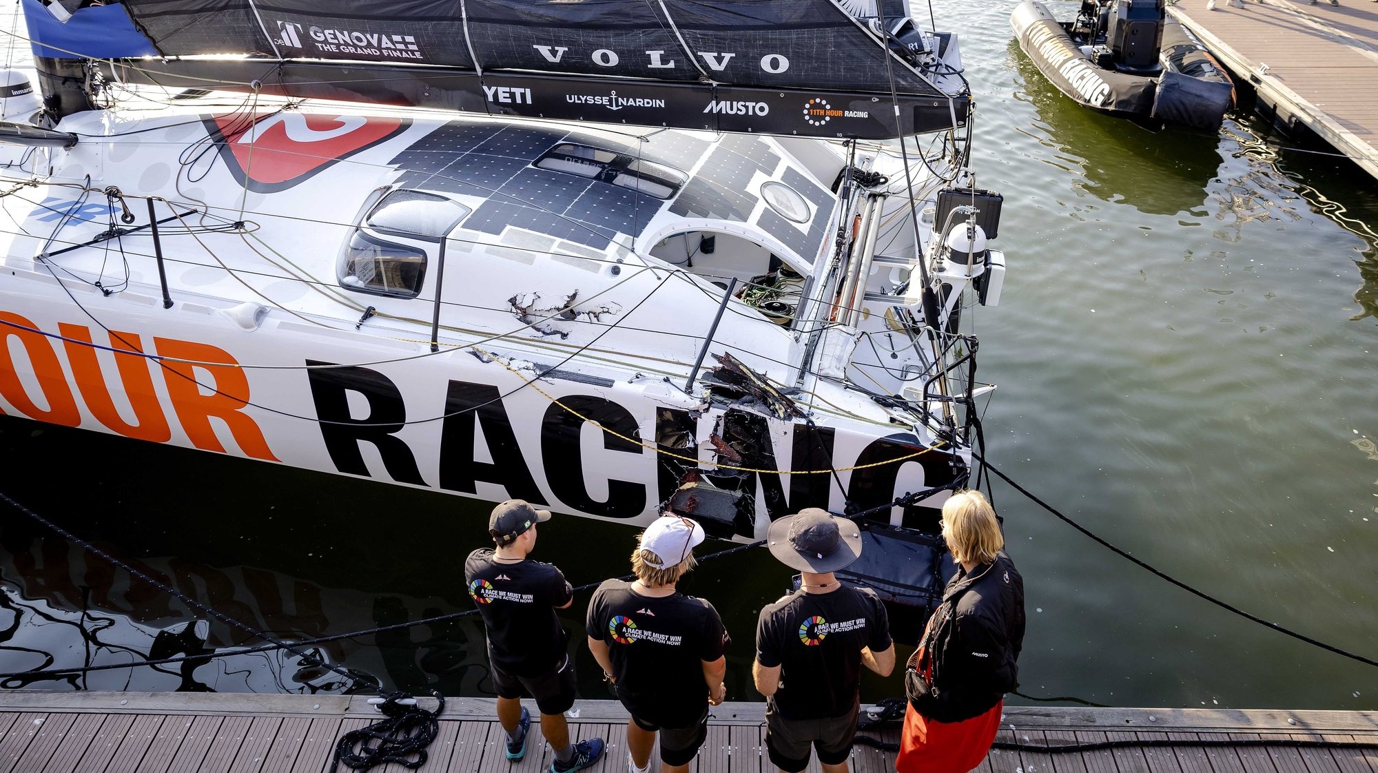 epa10693354 Damage to the boat of 11th Hour Racing Team that returned to the harbor after a collision while leaving the harbor for the last leg of the Ocean Race, in Scheveningen, Netherlands, 15 June 2023.  EPA/Robin van Lonkhuijsen