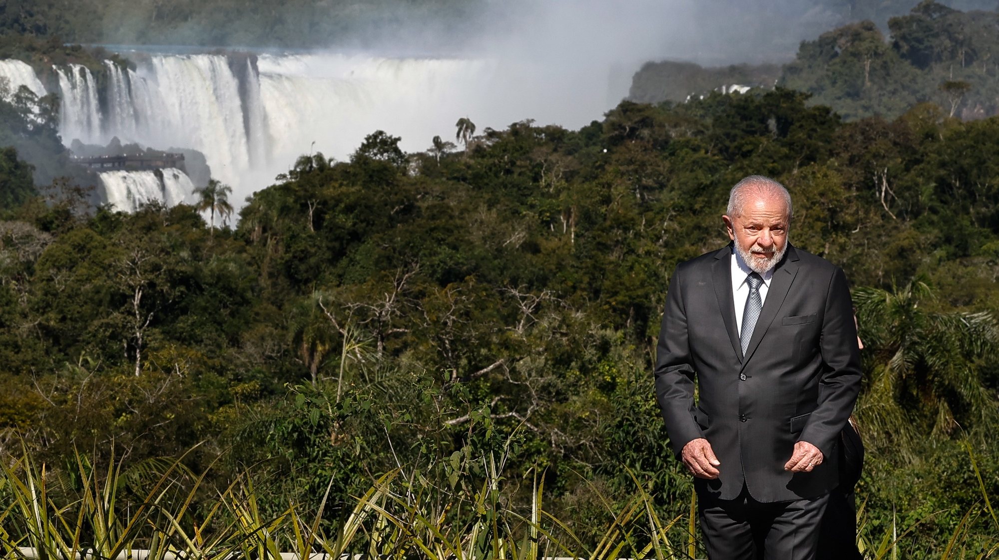 epa10726530 Brazilian President Luiz Inacio Lula da Silva stands with the waterfalls seen in the background during the Mercosur summit, in Puerto Iguazu, Argentina, 04 July 2023. Lula da Silva received the pro tempore presidency of Mercosur on 04 July from his Argentine counterpart Alberto Fernandez, who says goodbye to the bloc&#039;s summits, since he is not running for re-election. Fernandez handed over the Mercosur baton, which is also made up of Paraguay and Uruguay, to the progressive leader and closed the LXII Summit of Heads of State of the South American group, which was held in a luxurious hotel in Puerto Iguazu.  EPA/JUAN IGNACIO RONCORONI