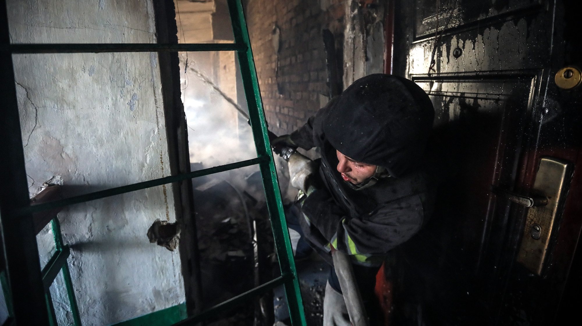 epa10755982 A Ukrainian firefighter works at an apartment block damaged by a fire following an artillery shelling, in Siversk town, in Donetsk region, 19 July 2023. The war in Ukraine, which started when Russia entered the country in February 2022, marked in July its 500th day. According to the UN, since the conflict started, more than 9000 civilians have been killed and more than 6 million others are now refugees worldwide.  EPA/OLEG PETRASYUK