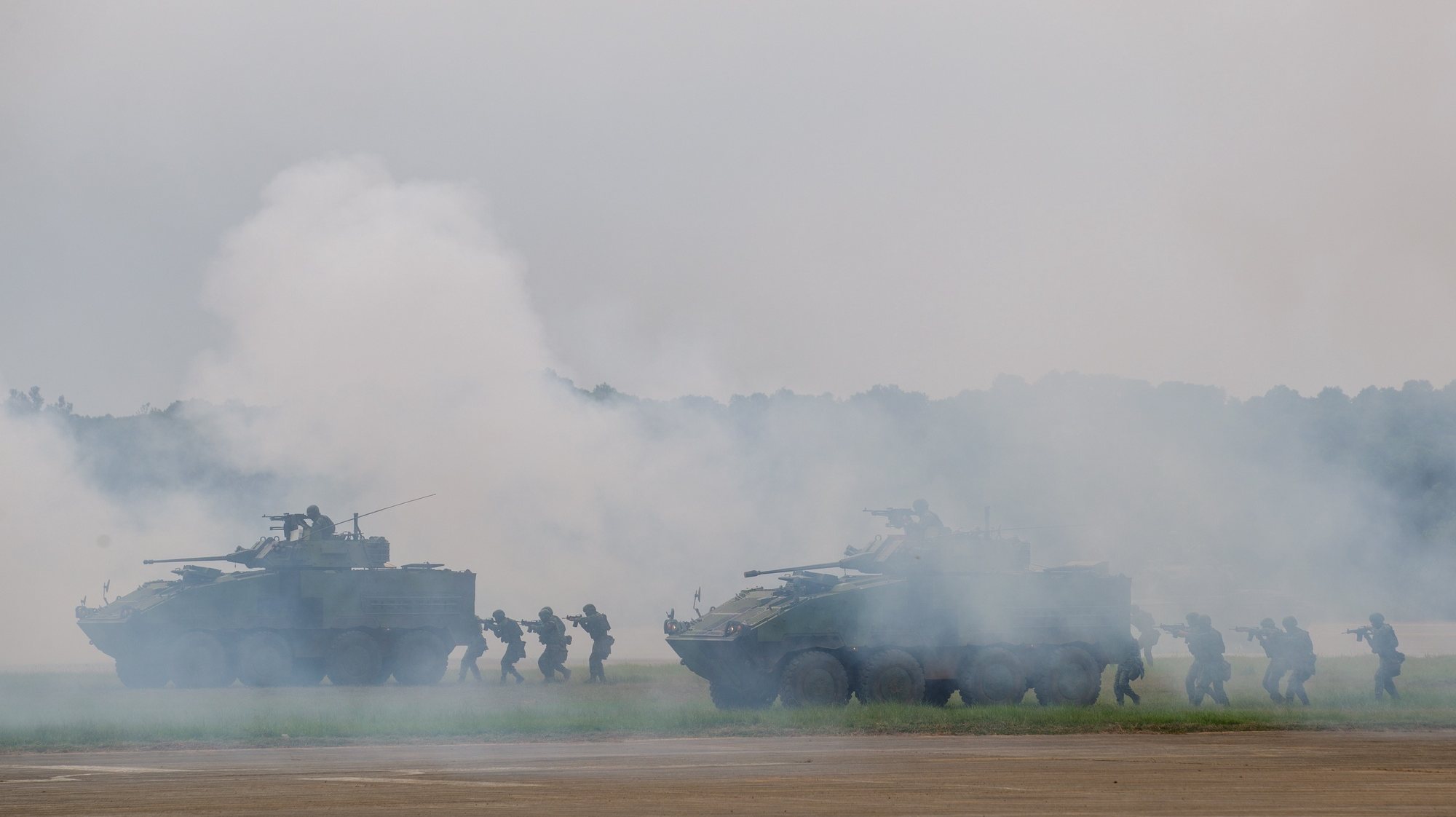 epa10873505 Taiwanese soldiers aboard CM32 battle tanks maneuver during an anti-invasion drill inside a military base in Hsinchu county, Taiwan, 21 September 2023. On 18 September, the Taiwanese military detected nine warships and 103 military aircraft from China near Taiwan. Taiwan&#039;s Ministry of National Defense has demanded that China cease its &#039;unilateral military harassment&#039;.  EPA/RITCHIE B. TONGO