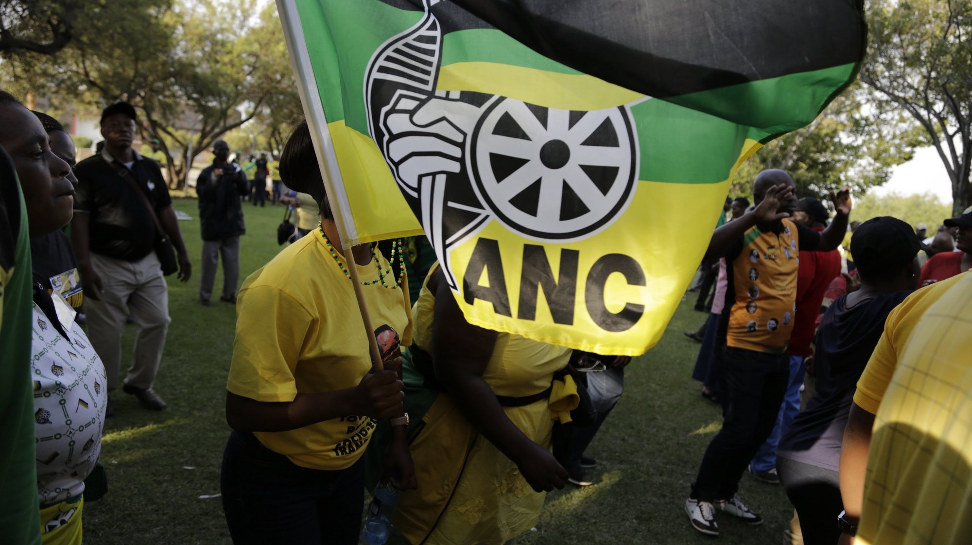 epa06393698 Supporters of deputy President Cyril Ramaphosa wave an ANC flag in his support during the 54th ANC National Conference held at the NASREC Convention Centre, Johannesburg , South Africa, 16 December 2017. The ruling ANC led by its President and President of South Africa, Jacob Zuma, has been reeling recently under allegations of corruption and and loss of support from its core voters. The ANC (African National Congress) formally led by Nelson Mandela led the country to freedom from white rule and the Apartheid system during the first free and fair elections in 1994. The convention continues for five days.  EPA/Cornell Tukiri