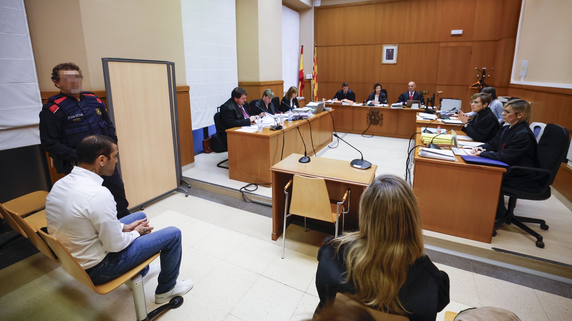 epa11171735 (FILE) - Brazilian soccer player Dani Alves (L) sits in the dock during his trial for alleged sexual assault at Barcelona&#039;s Court in Barcelona, Spain, 05 February 2024  (reissued 22 February 2024). A court in Barcelona on 22 February 2024 found Alves guilty of sexually assaulting a young woman in the bathroom of a nightclub in Barcelona in December 2022, and sentenced Alves to four and a half years in prison.  EPA/Alberto Estevez / POOL IMAGE PIXELATED AT SOURCE
