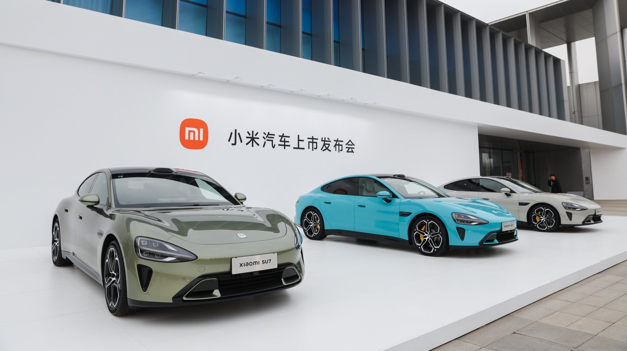 epa11248083 Xiaomi SU7 electric cars displayed at Beijing Etrong International Exhibition and Convention Center, in Beijing, China, 28 March 2024. Xiaomi released its new electric car product &#039;SU7&#039; on 28 March 2024.  EPA/WU HAO