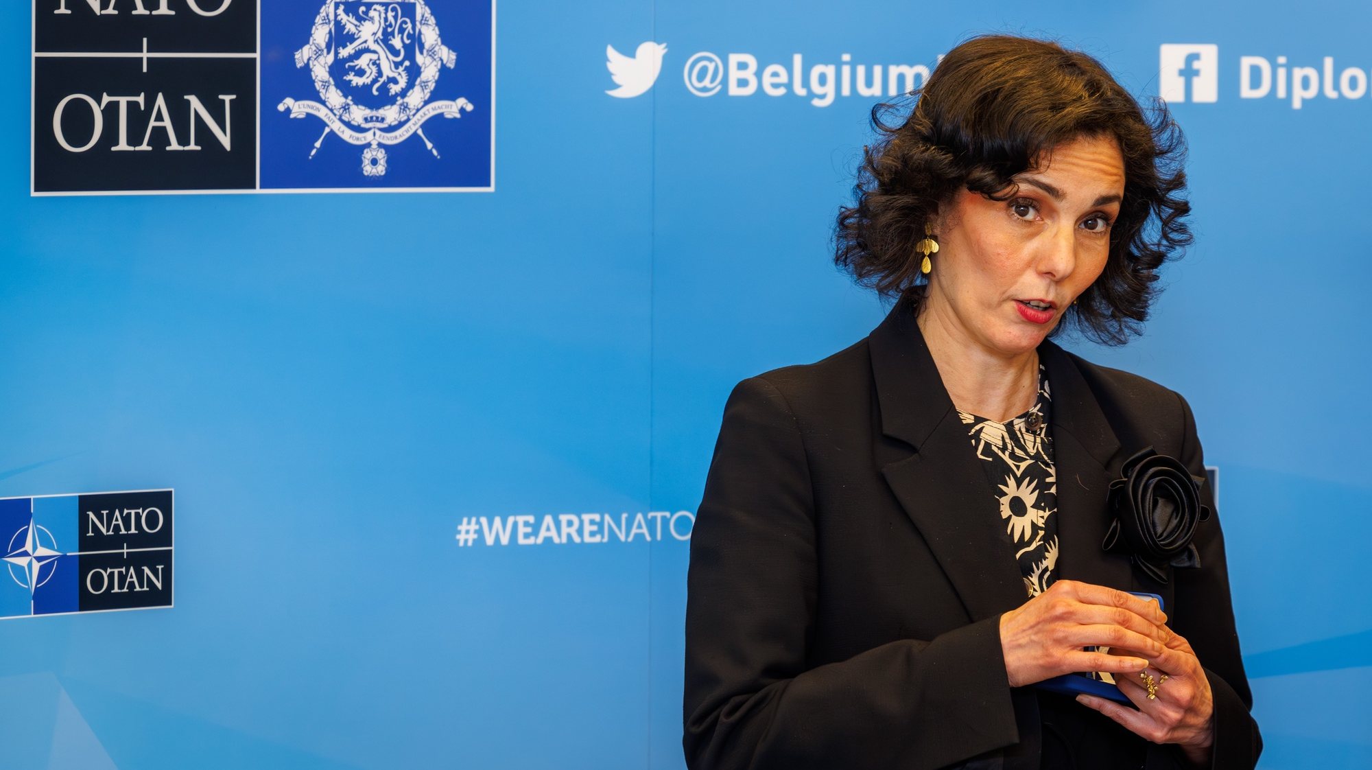 epa11255621 Belgian Minister of Foreign Affairs Hadja Lahbib unveils a Silver 10 Euro coin to commemorate 75 years of North Atlantic Treaty Organization (NATO) foundation at the Alliance headquarters in Brussels, Belgium, 02 April 2024. The event celebrating the enduring partnership between NATO and Belgium also coincides with the 75th anniversary of the Alliance. The intergovernmental military alliance NATO was founded on 04 April 1949.  EPA/OLIVIER MATTHYS