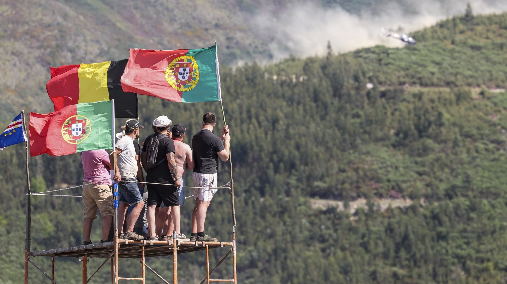 Rally fans watch competitors pass during the Rally Portugal 2024 as part of the World Rally Championship (WRC) in Arganil, Portugal, 10 May 2024. PAULO NOVAIS/LUSA