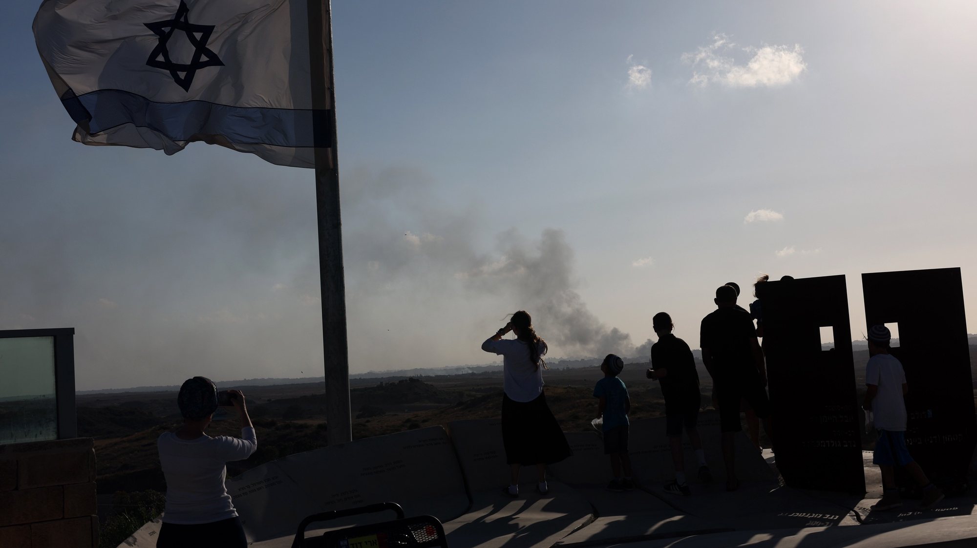 epa11337609 Israelis from the city of Sderot in southern Israeli watch as smoke rises following an Isareli army strike on Jabalia in the northern Gaza Strip, as seen in southern Israeli city of Sderot,  13 May 2024. More than 35,000 Palestinians and over 1,455 Israelis have been killed, according to the Palestinian Health Ministry and the Israel Defense Forces (IDF), since Hamas militants launched an attack against Israel from the Gaza Strip on 07 October 2023, and the Israeli operations in Gaza and the West Bank which followed it  EPA/ATEF SAFADI