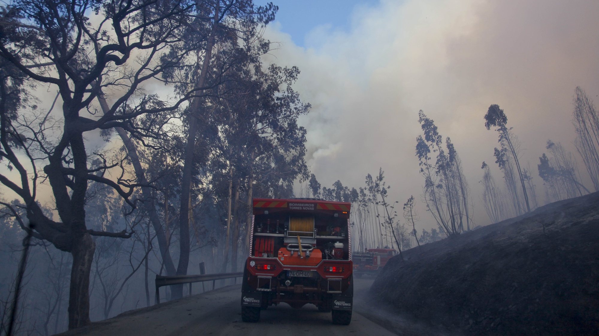 Two firefighter trucks participate in combat of a forest fire in Pedrogao Grande, center of Portugal, 6 August 2015. This forest fire gathers 104 land vehicules, 4 planes and 3 helicopters. PAULO CUNHA/LUSA