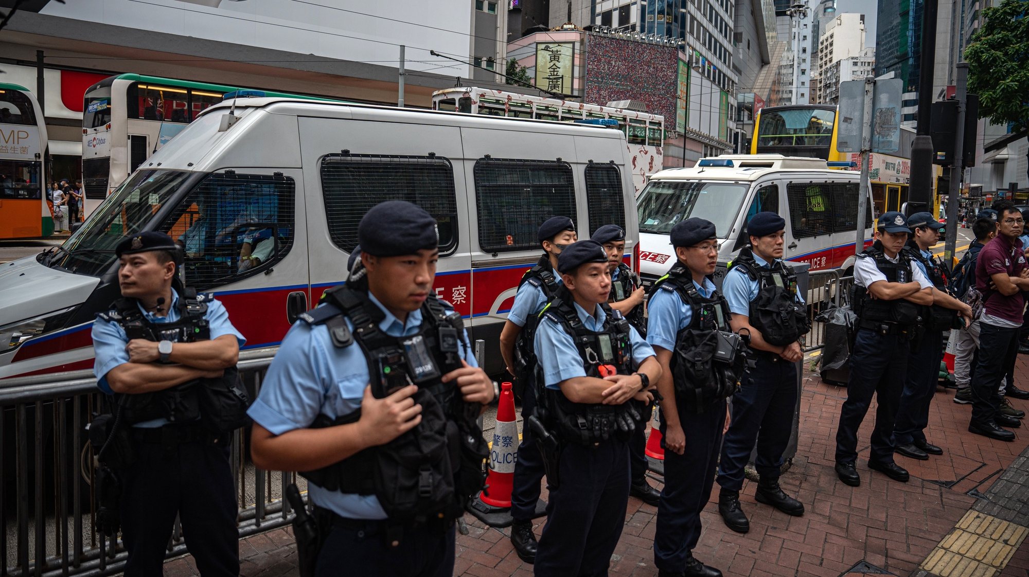 epa11389365 Police officers stand guard at Causeway Bay near Victoria Park in Hong Kong, China, 04 June 2024. For almost three decades, people in Hong Kong commemorated the 04 June anniversary of China&#039;s deadly crackdown on protesters in Tiananmen Square with a noisy candlelit vigil in the city&#039;s Victoria Park. The subject has become so sensitive that a remembrance of the crackdown at Tiananmen Square, which had previously been held in nearby Victoria Park, has no longer taken place since the new national security law came into effect.  EPA/LEUNG MAN HEI