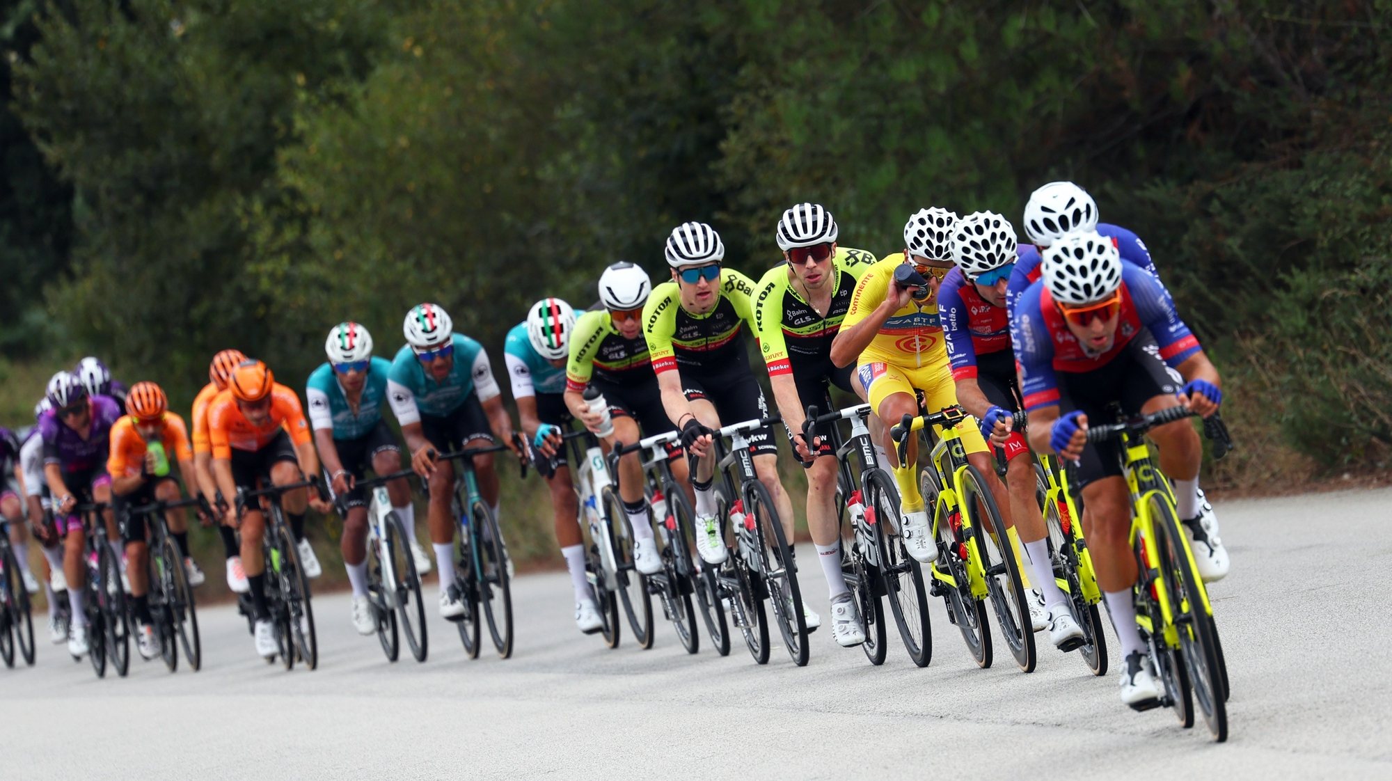 Portuguese rider Afonso Eulálio (ABTF - Feirense), the general classification leader, drinks water as he follows his teamates during the 7th stage of the 85th Portugal Cycling Tour over 160,4 Km, between Felgueiras and Paredes, Portugal, 01 August 2024. NUNO VEIGA/LUSA