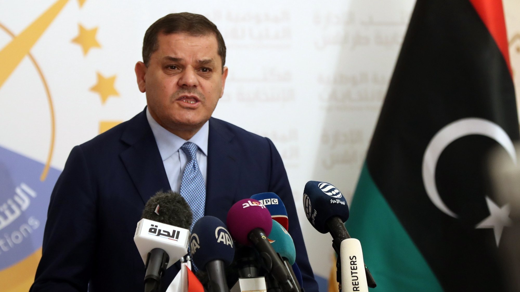 epa09596533 Libyan Prime Minister Abdul Hamid Dbeibah speaks after submitting his candidacy papers for the upcoming presidential election at the headquarters of the electoral commission in Tripoli, Libya, 21 November 2021.  EPA/STR
