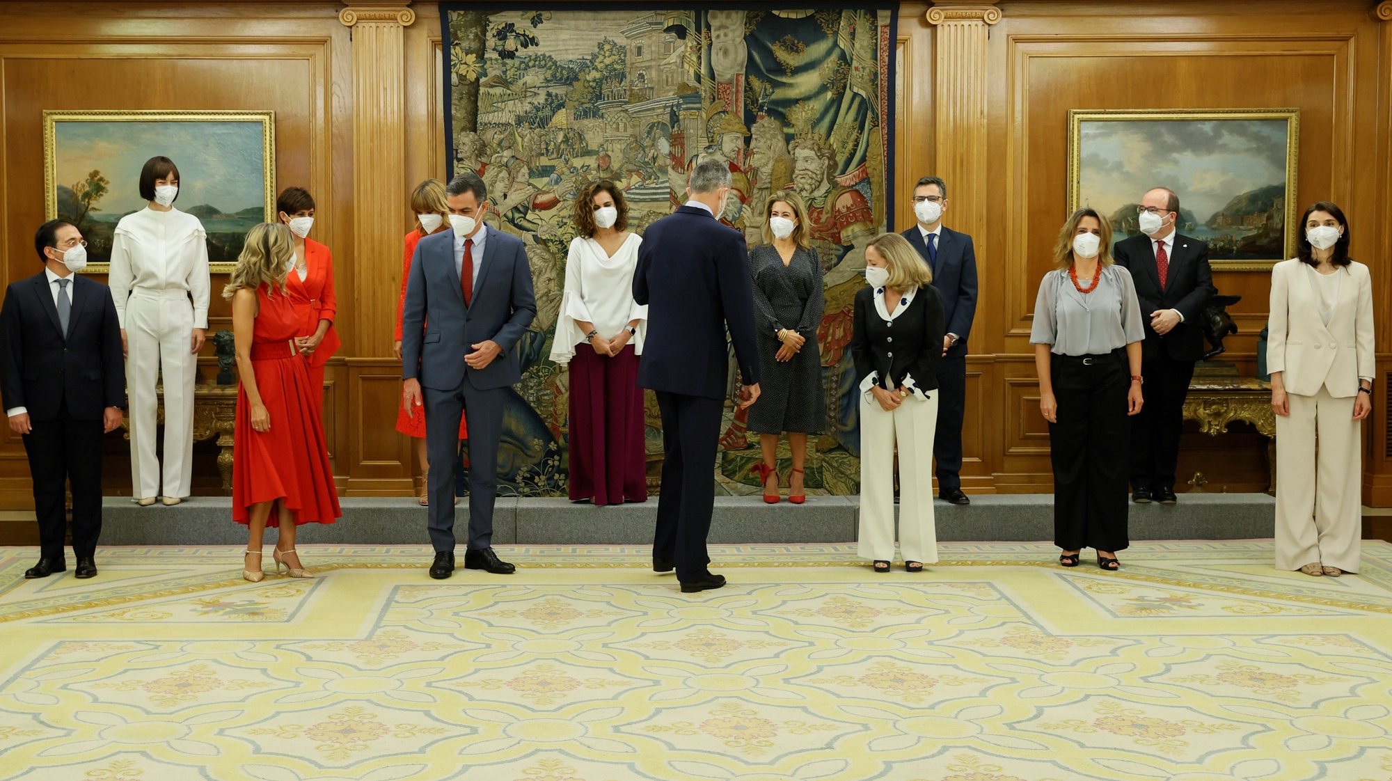 epa09339637 Spain&#039;s King Felipe VI (C, front) and Spanish Prime Minister Pedro Sanchez (3L, front) prepare to pose for a family photo with the new members of Spanish Cabinet during the swearing-in ceremony at La Zarzuela Palace, in Madrid, Spain, 12 July 2021. Spanish Prime Minister Pedro Sanchez announced a deep change in his Cabinet aimed to boost economic recovery after the impact of COVID-19 pandemic.  EPA/BALLESTEROS / POOL