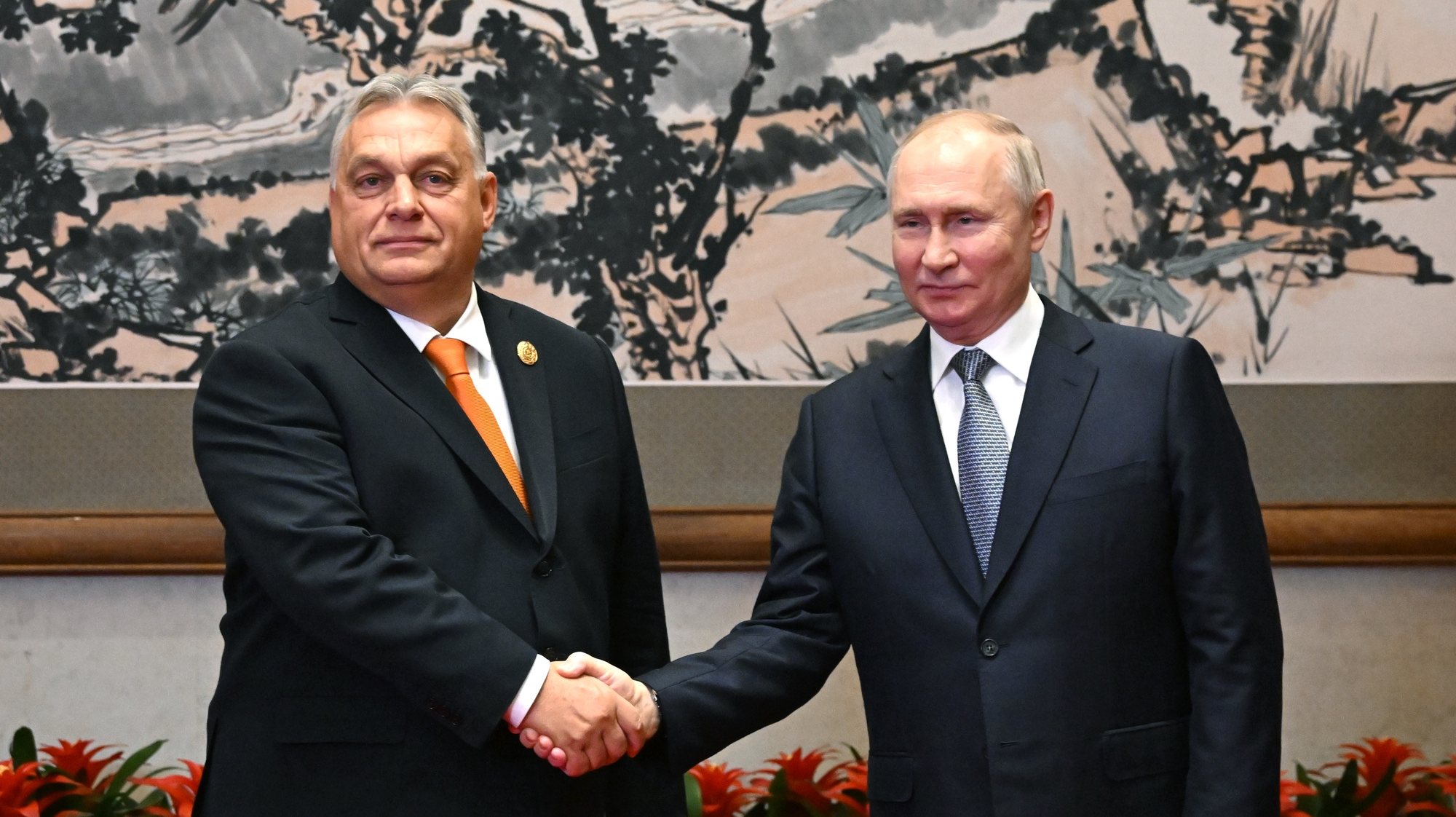 epa10923359 Hungarian Prime Minister Viktor Orban (L) and Russian President Vladimir Putin shake hands before their meeting as part of the 3rd Belt and Road Forum at the Diaoyutai State Guest House in Beijing, China, 17 October 2023. Russian President Vladimir Putin attends the &#039;One Belt, One Roadâ€™ forum in Beijing on October 17-18. As part of this trip, he plans to hold talks with Chinese President Xi Jinping.  EPA/GRIGORY SYSOEV /SPUTNIK / KREMLIN POOL MANDATORY CREDIT