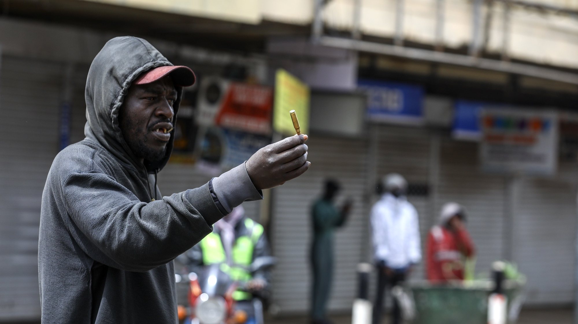 epa11441121 A man holds an empty ammunition shell during a renewed protest two days after deadly protests against tax hikes in Nairobi, Kenya, 27 June 2024. Kenyan President William Ruto said on 26 June that he wouldn&#039;t sign into law a finance bill proposing new tax hikes, a day after protesters stormed the parliament and several people were shot dead. At least 22 people have lost their lives in protests against tax hikes since 25 June 2024, according to Kenya National Human Rights Commission.  EPA/DANIEL IRUNGU