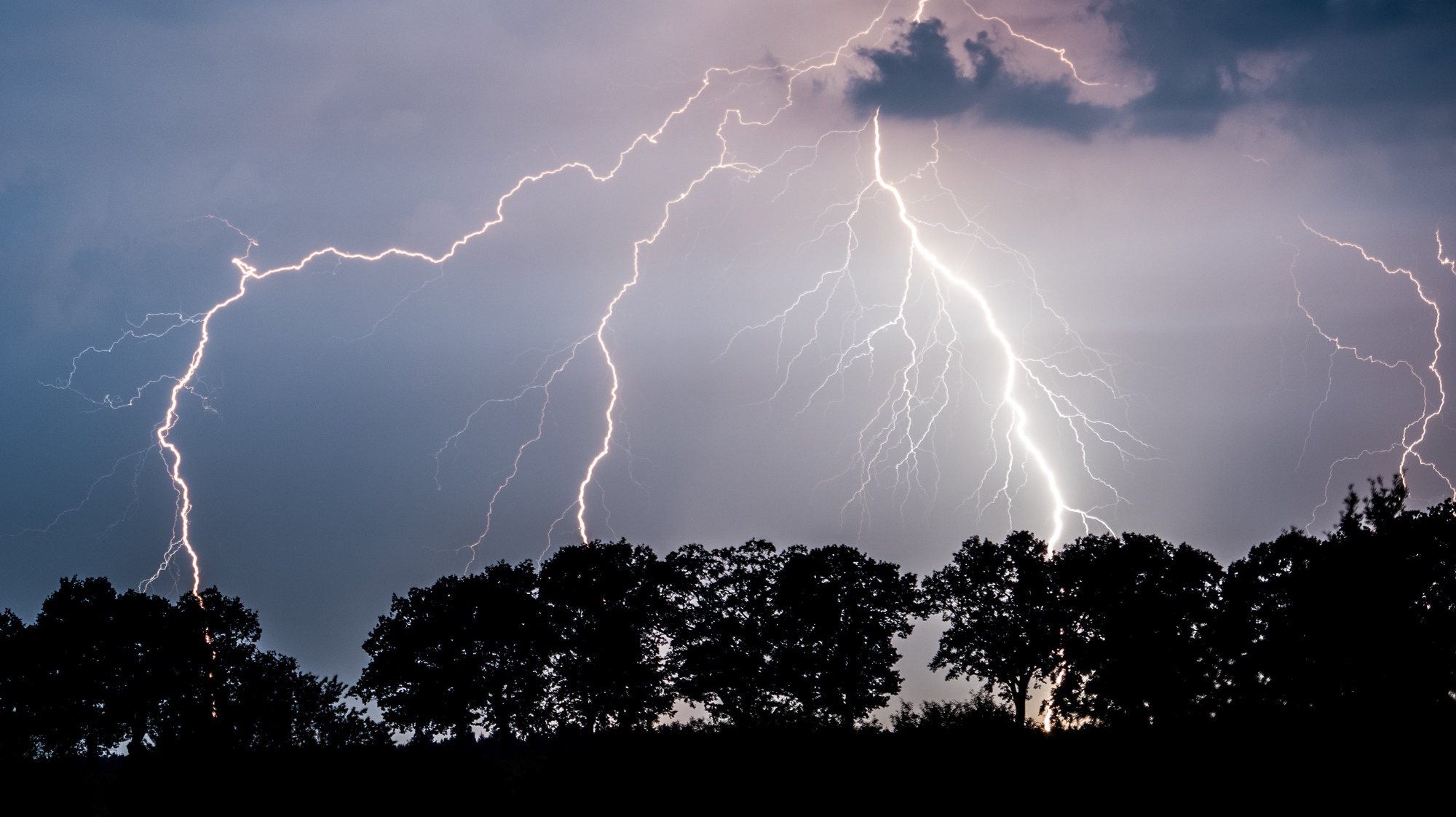epa07655088 (FILE) Lightning illuminates the nigh sky over Landkreis Oder-Spree in Jacobsdorf, Brandenburg, Germany 01 September 2015 (issued 18 June 2019). German forecasters have issued severe weather warnings for the Corpus Christi bank holiday 20 June 2019 with heavy thunderstorms expected across the country.  EPA/PATRICK PLEUL *** Local Caption *** 52174756