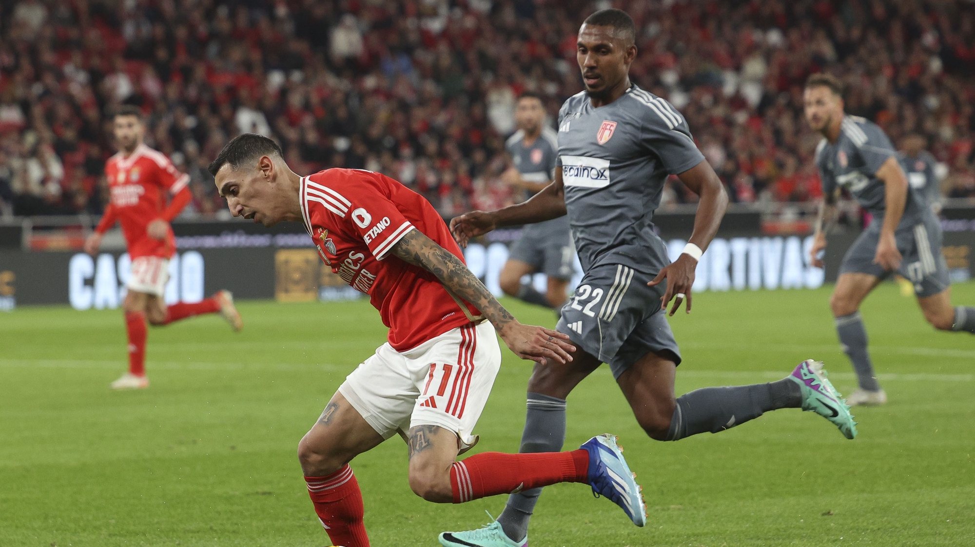 Benfica player Angel Di Maria (L) in action against AVS player Leo Alaba during their  Portuguese Cup League soccer match, held at Luz Stadium, in Lisbon, Portugal, 21 December 2023. TIAGO PETINGA/LUSA