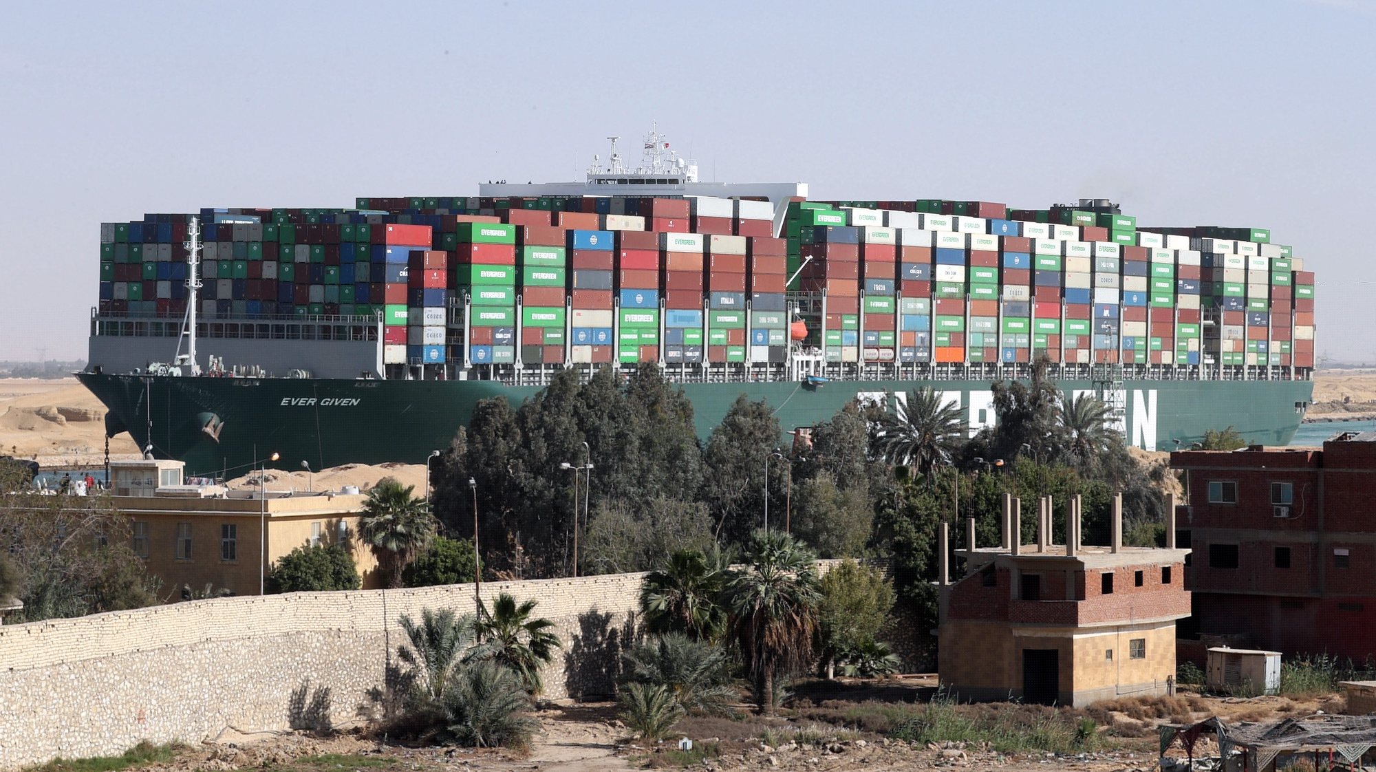 epa09134869 (FILE) - The container ship &#039;Ever Given&#039; is moving in the Suez Canal, Egypt, 29 March 2021 (reissued 14 April 2021). The Suez Canal Authority (SCA) has seized the ship over an unsettled claim of over 900 Million US dollars for compensation, the Ever Given&#039;s insurer UK Club said. The Ever Given ran aground in the Suez Canal on 23 March, causing a huge traffic backlog of ships.  EPA/KHALED ELFIQI *** Local Caption *** 56794878