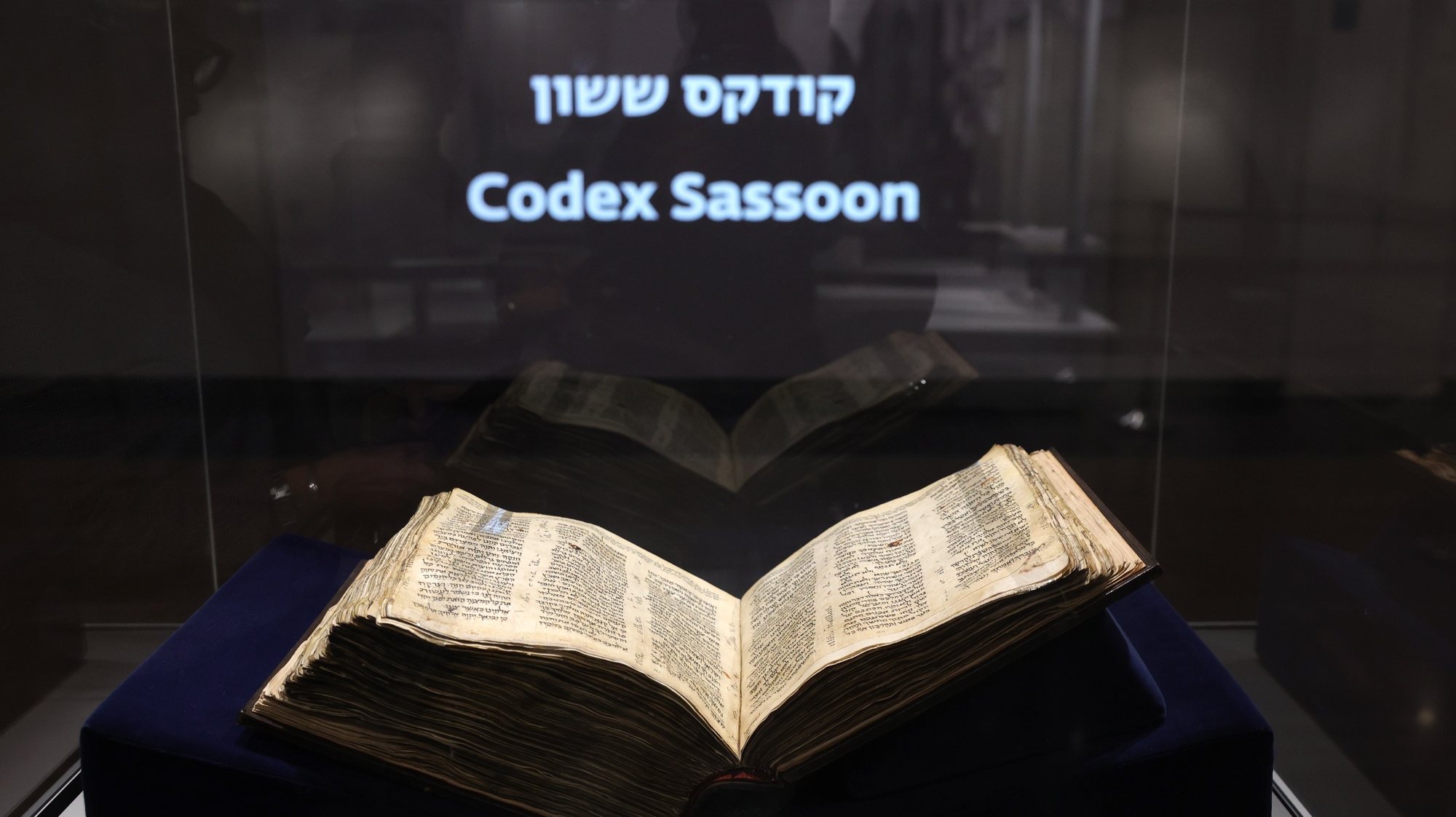 epa10537004 The Codex Sassoon, the oldest complete Hebrew Bible is on display at the ANU Museum of the Jewish People in Tel Aviv, Israel, 22 March 2023. Dating from the early 10th century, the Codex Sassoon bible will be on public display from 23 to 29 March in Tel Aviv. After that the book will be auctioned by Sotheby’s in New York, USA on 16 May, with an estimated price of 30 to 50 million dollars.  EPA/ABIR SULTAN