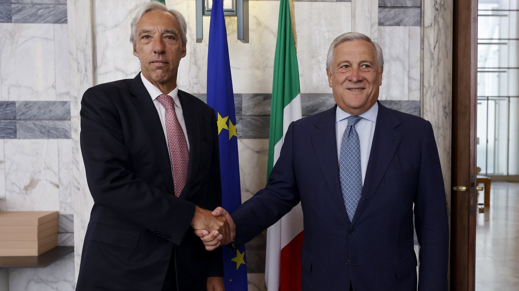 epa10847951 Italian Foreign Minister Antonio Tajani (R) shakes hands with his Portuguese counterpart Joao Gomes Cravinho (L) during a meeting in Rome, Italy, 08 September 2023.  EPA/VINCENZO LIVIERI