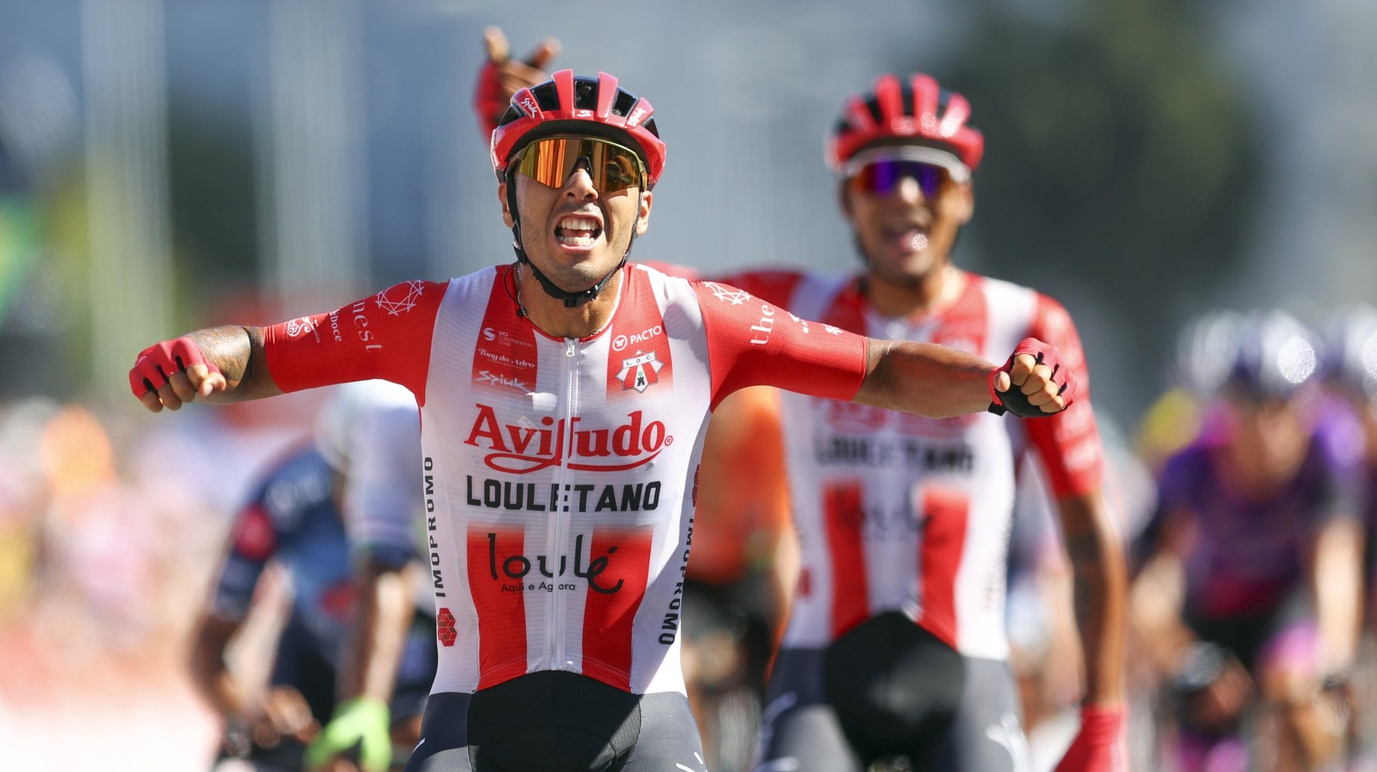 Argentinian rider Nicolas Tivani (Aviludo-Louletano-Loule Concelho) team celebrates after winning the 2th stage of the 85rd Portugal Cycling Tour over 164,5 Km, between Santarem and Lisbon, Portugal, 26 July 2024. NUNO VEIGA/LUSA