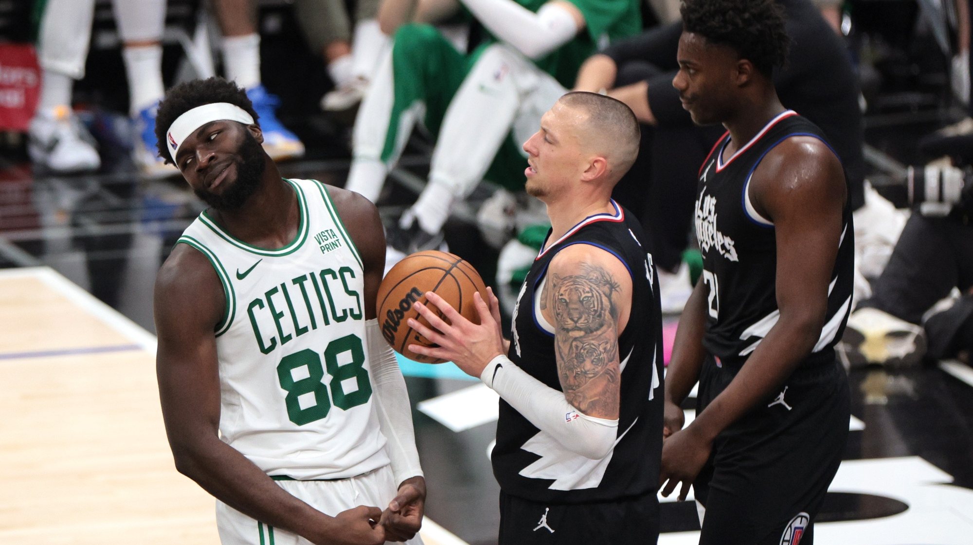 epa11042645 Boston Celtics center Neemias Queta (L) reacts to a foul call during the second half of the NBA basketball game between the Boston Celtics and Los Angeles Clippers in Los Angeles, California, USA, 23 December 2023.  EPA/ALLISON DINNER  SHUTTERSTOCK OUT