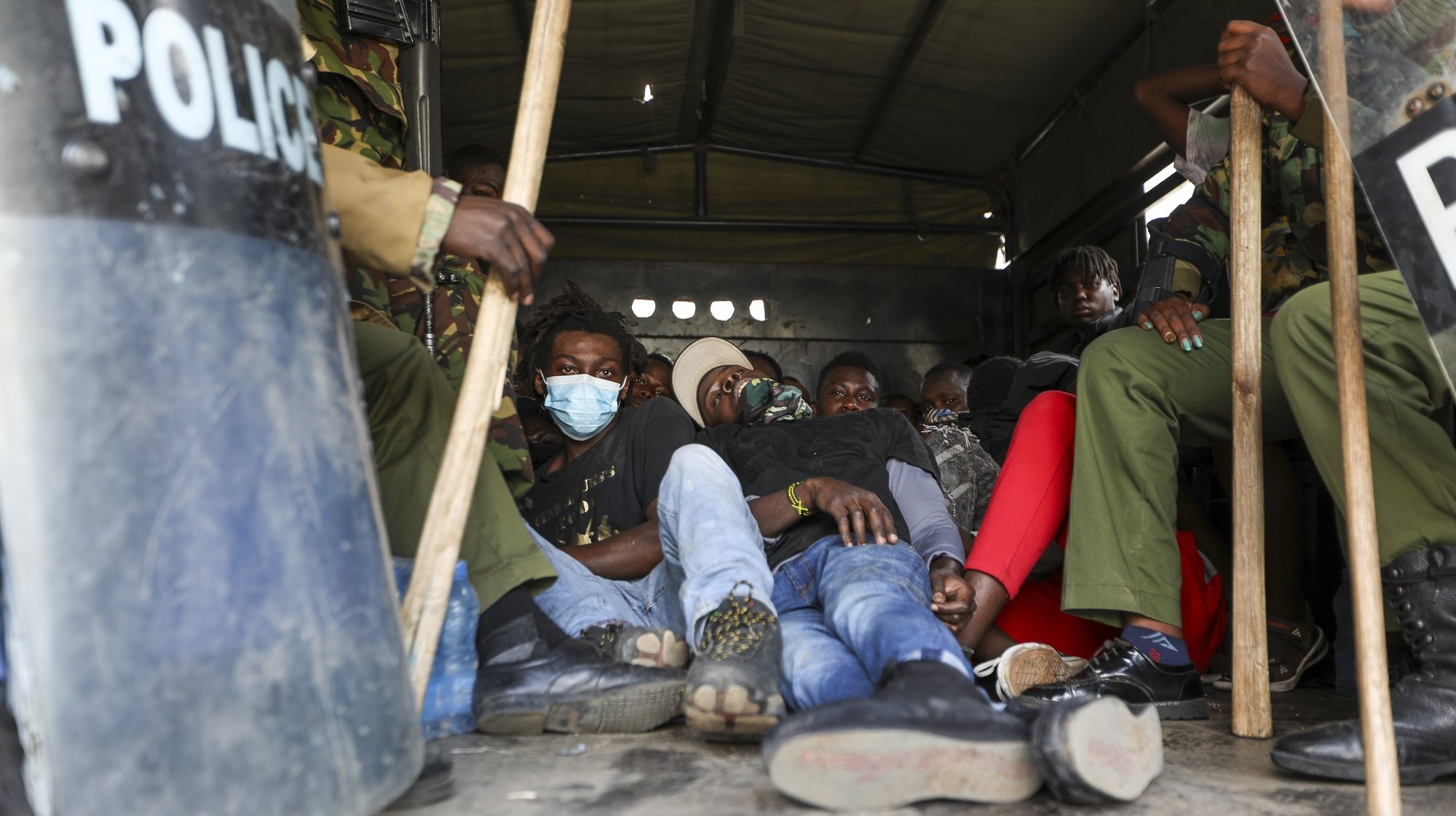 epa11453606 People sit in a police truck after being detained by police during an anti-government rally in Nairobi, Kenya, 02 July 2024. Demonstrators took to the streets despite Kenyan President William Ruto&#039;s announcement on 26 June that he would not sign into law a finance bill proposing new tax hikes. According to the state-funded Kenya National Commission on Human Rights (KNCHR), at least 39 people have died and 361 were injured in protests against tax hikes countrywide.  EPA/DANIEL IRUNGU