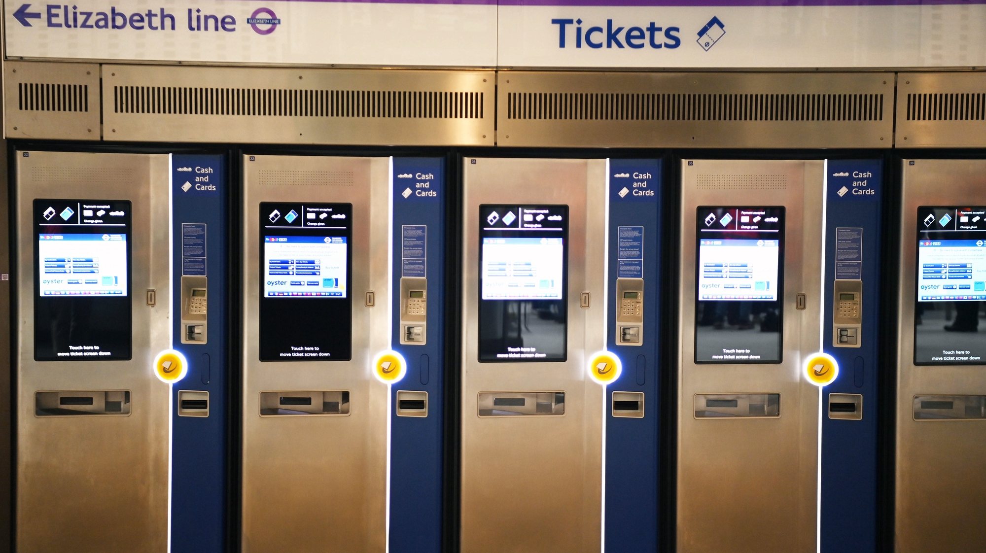epa09941323 Ticket machines on an empty station on the underground section of the Elizabeth Line at Paddington in London, Britain, 11 May 2022 (issued 12 May 2022). Transport for London (TfL) has announced the delayed and over-budget Crossrail project will open to passengers on 24 May 2022. Known as the Elizabeth line, it was scheduled to start in December 2018 but the 18.8-billion-GBP project has missed multiple targets amid rising costs.  EPA/NEIL HALL