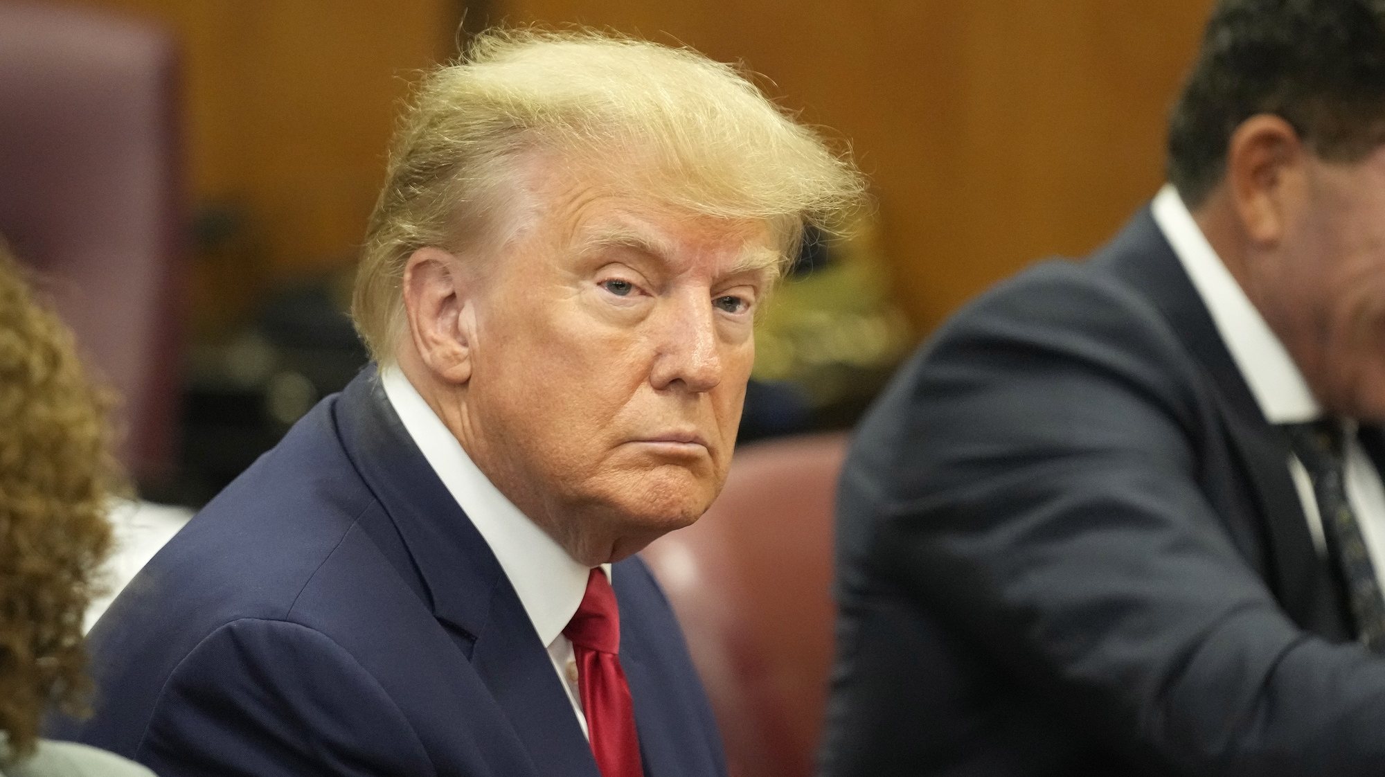 epa10558784 Former US President Donald J. Trump sits in the courtroom for his arraignment in New York Criminal Court in New York, New York, USA, 04 April 2023. A Manhattan grand jury voted to indict former President Donald J. Trump last week.  EPA/SETH WENIG POOL